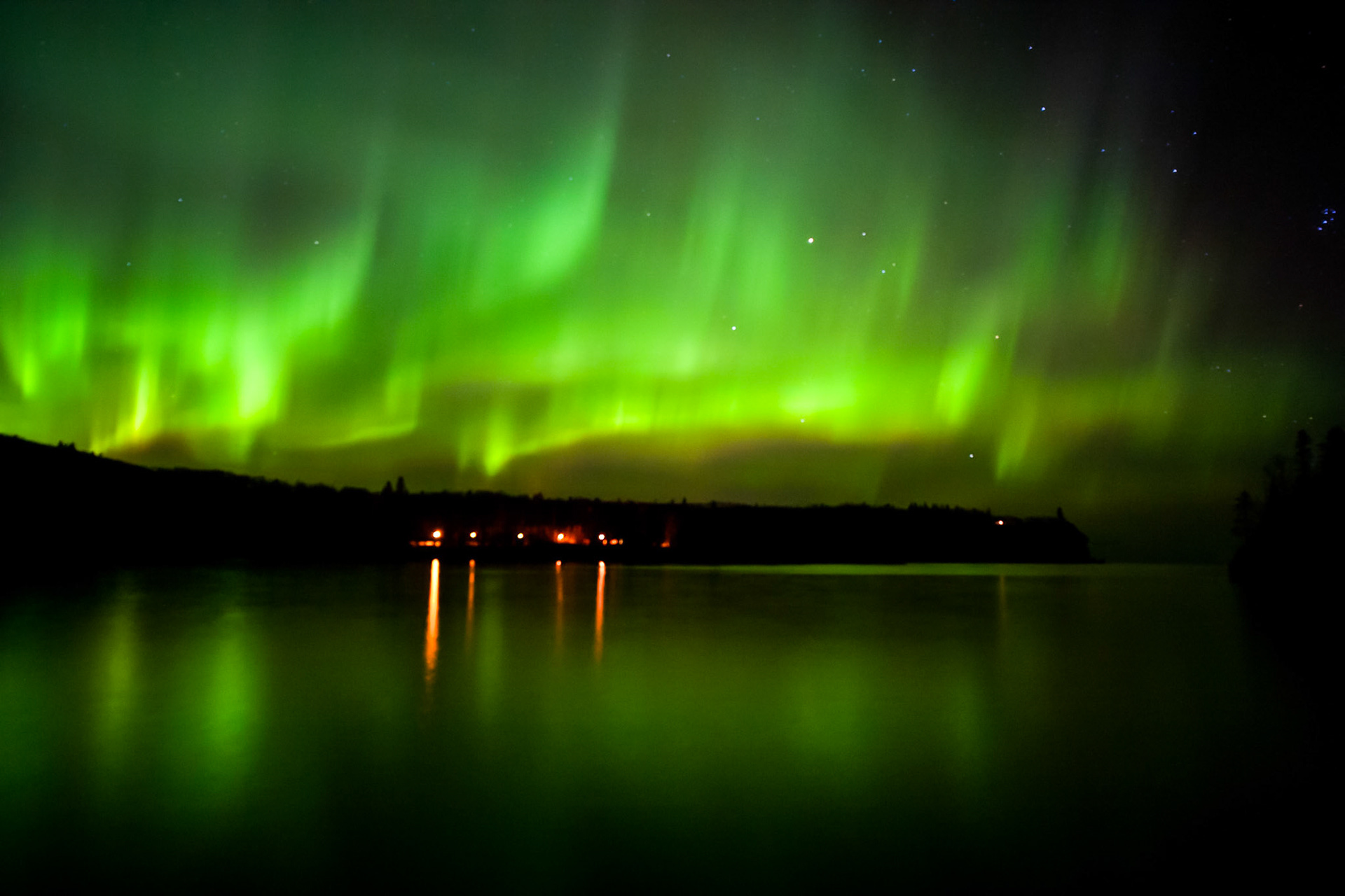 November 8 - Light Dance over Split RockThe Northern Lights dance over Split Rock State Park on a calm November night.Split Rock State Park in Minnesota is one of the best places to witness this phenomenon. Its location on the north shore of Lake Superior makes it an ideal spot to capture the aurora borealis in all its glory. On a calm November night, the park's rocky cliffs and lighthouse provide a breathtaking backdrop to the dancing lights. It's a surreal and unforgettable experience that leaves visitors in awe of nature's beauty.In the beginning, God created the heavens and the earth. Genesis 1:1