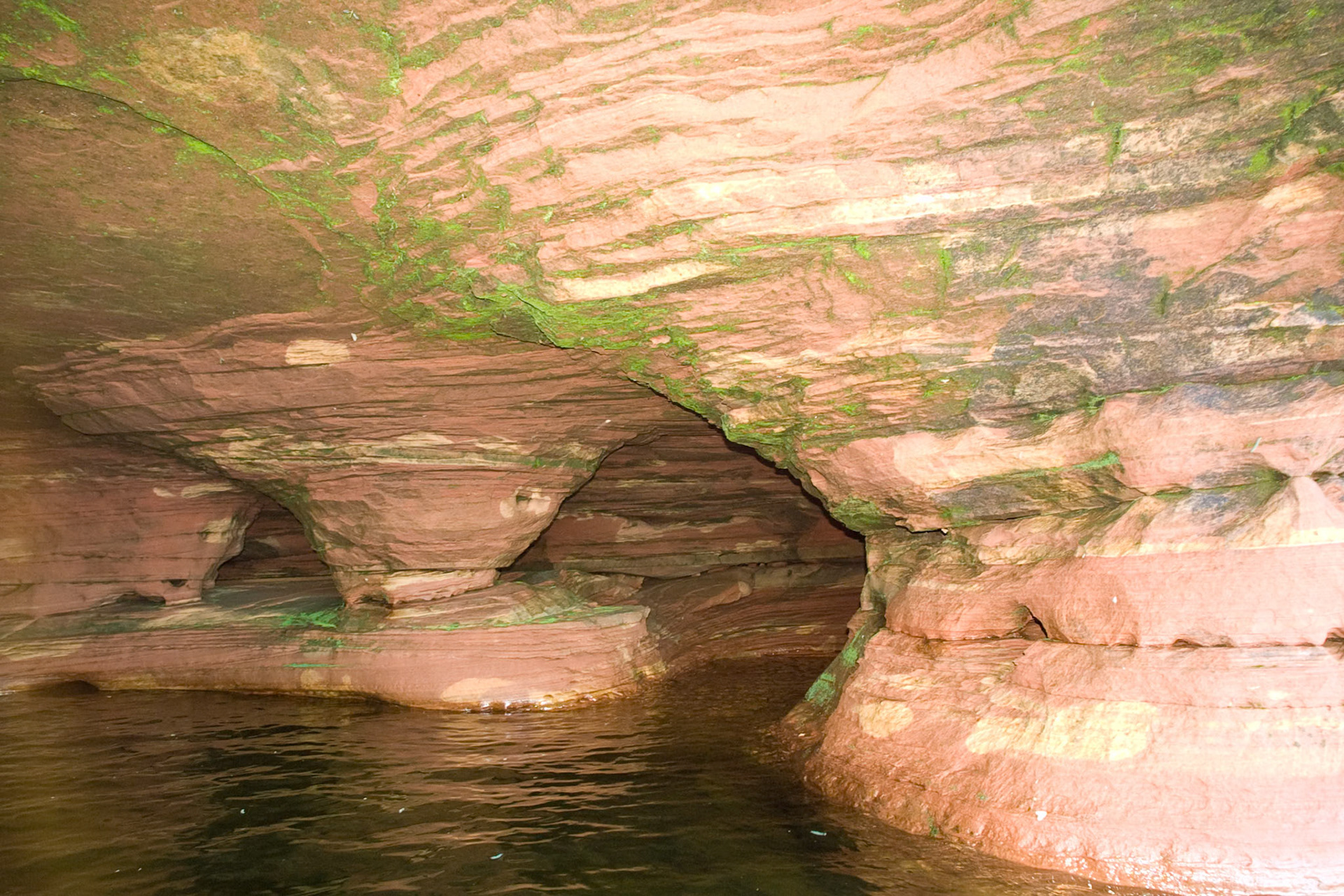 The Apostle Islands sit just off shore from the Bayfield Peninsula on Lake Superior. Erosion of the sandstone has carved out sea caves which can be visited by boat during the summer, and on skies during colder winters. The caves are one of the wonders of the region and give new meaning to "Heaven on Earth".
