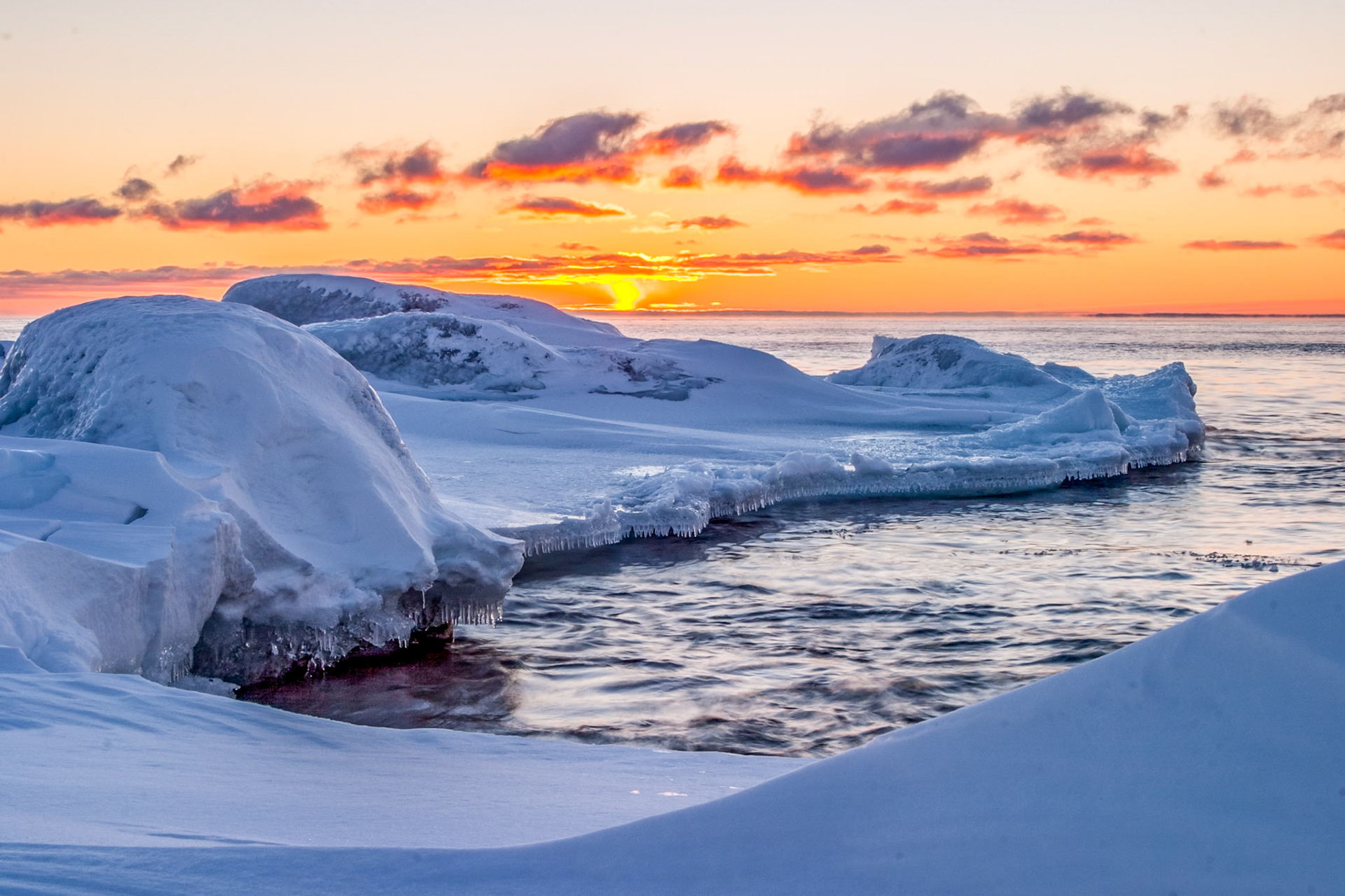 .February 15 - Fire and Ice Brighton Beach in Duluth is a beautiful place to watch the sunrise, waves, ice, and the big lake. Soon, these winter landscapes will melt into the big lake as Springtime draws closer. By now, we are gaining 2 minutes more daylight per day compared to early January — one of the fastest daylight-increase rates of the entire year. This boost is what jump-starts late-winter melting, longer twilights, and the first subtle signals of Spring.With the harshness of January cold behind us, there is much hope for the warmer days of Spring just ahead. The increasing daylight hours prove it, and the melting ice hints at it. So that those who dwell at the ends of the earth are in awe at your signs. You make the going out of the morning and the evening to shout for joy. Psalm 65:8  Thank you, Lord, for giving us a fresh new hope for today, and the promises that lie ahead. Today is a gift, spend it wisely.