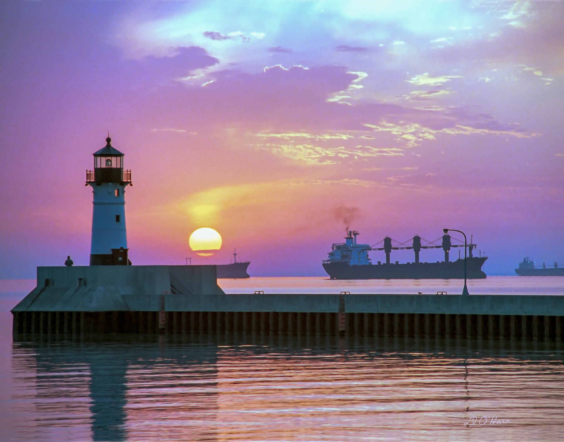 Summer sunrises over Lake Superior come in the early hours of 5AM.  A trip to the usually cool lakeshore to take in a "Superior Sunrise", makes the loss of sleep, a small price to pay, for the beauty to behold.