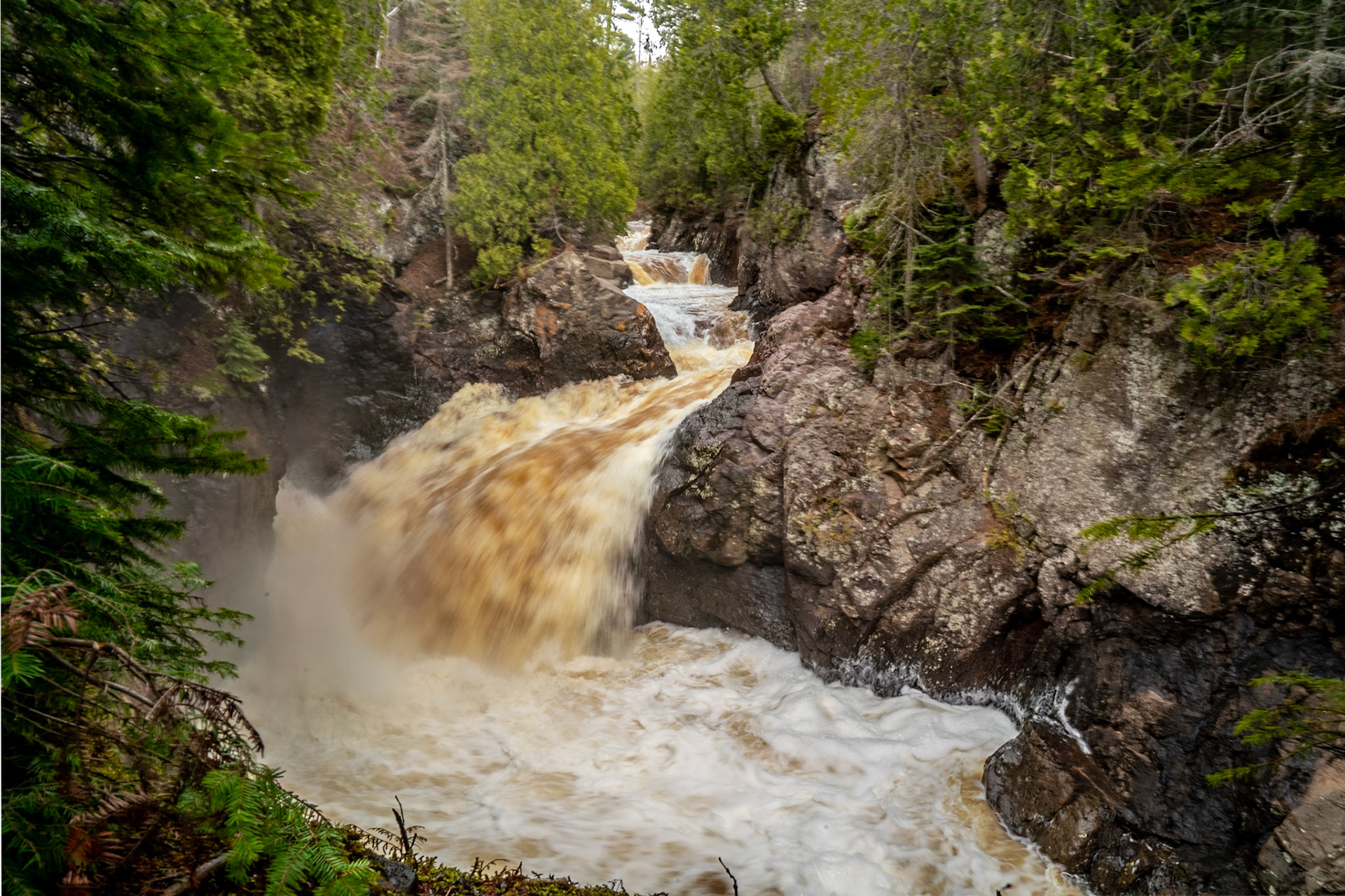 May 6 - Cascading Into Spring - With Spring Runnoff in full swing, the swollen rivers along the north shore of Lake Superior are roaring with life.The Cascade River winds through the rocky canyons, and the sights, sounds, and fresh smells dance into a beautiful scene and lasting memory."Like a waterfall, refresh my spirit, O Lord. 'Deep calls to deep in the roar of your waterfalls; all your waves and breakers have swept over me.'" Psalm 42:7This verse beautifully captures the essence of water's powerful and refreshing nature, much like the cascading rivers in your text.