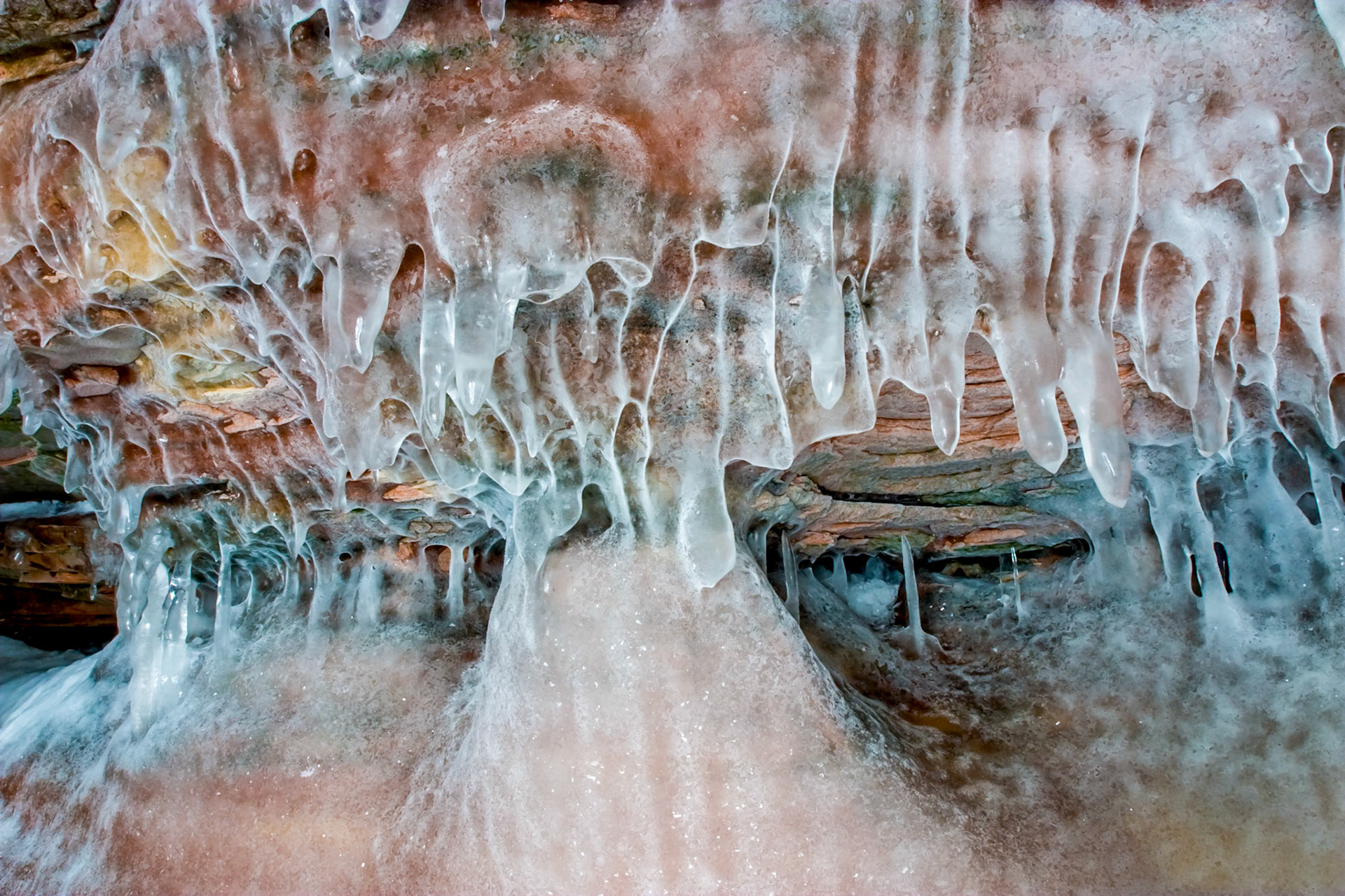 March 16 - Icy CavesThe Apostle Islands sit just offshore from the Bayfield Peninsula on Lake Superior. Erosion of the sandstone has carved out sea caves which can be visited by boat during the summer and on skies during colder winters. The caves are one of the region's wonders and give new meaning to "Heaven on Earth."Be exalted, O God, above the heavens! Let your glory be over all the earth! Psalm 57:5Viewing these wonders causes one to appreciate creation and give thanks for the beauty of the earth.