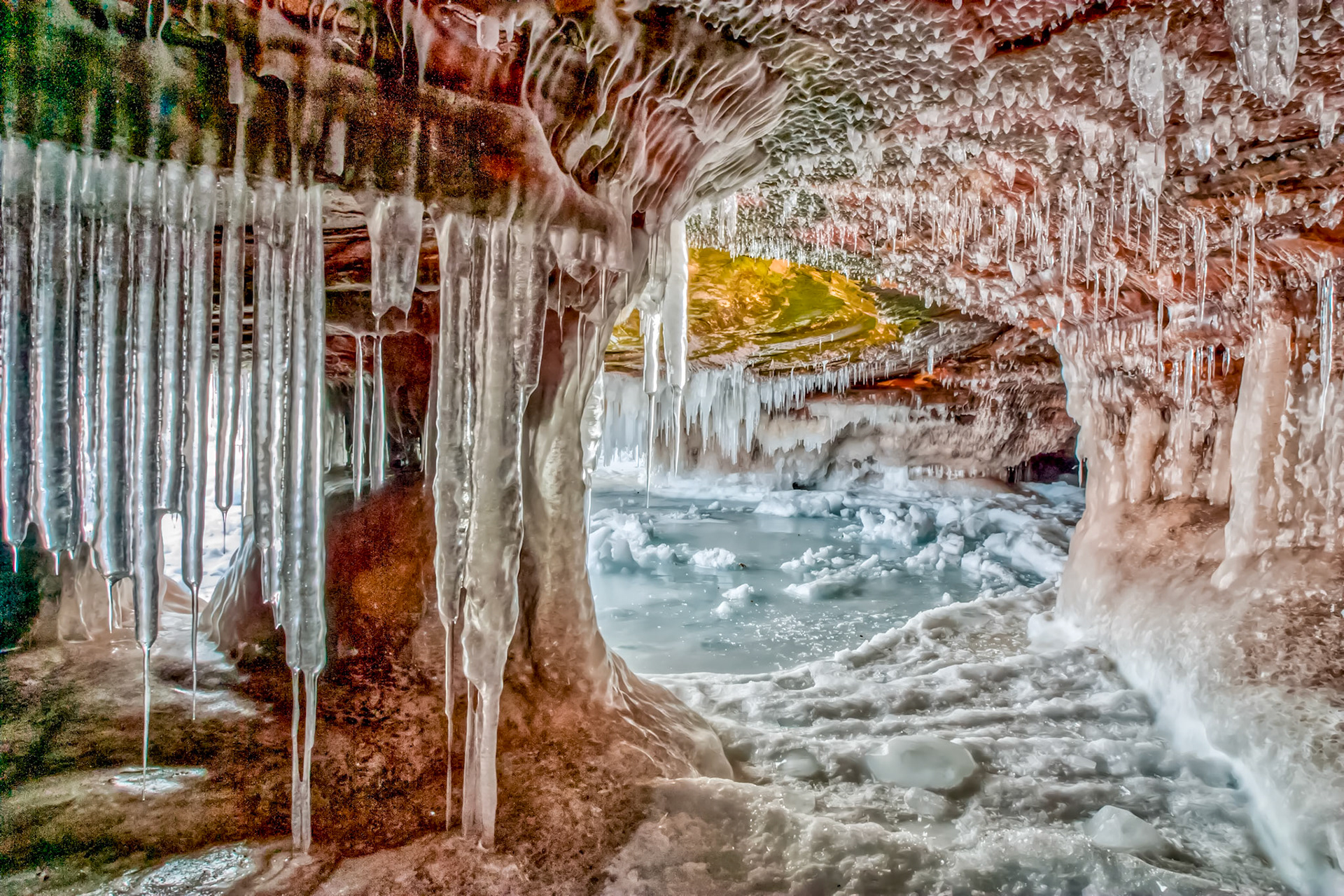 March 12 - Apostle Island Sea CavesThe Apostle Island sea caves are a fantastic place to visit in early March, provided ice conditions on Lake Superior permit. The incredible view of the sandstone caverns, splashed with winter's ice from Lake Superior, is a sight to behold.When you enter the caves, you feel you are walking into a work of art that has taken eons to craft. Indeed, the elements were used as tools in God's hands to create these incredible echo chambers.As you slip and slide through the caves, the only word to express your view is WOW! What a gift! A true reason to appreciate creation."Have you entered the storehouses of the snow, or have you seen the storehouses of the hail