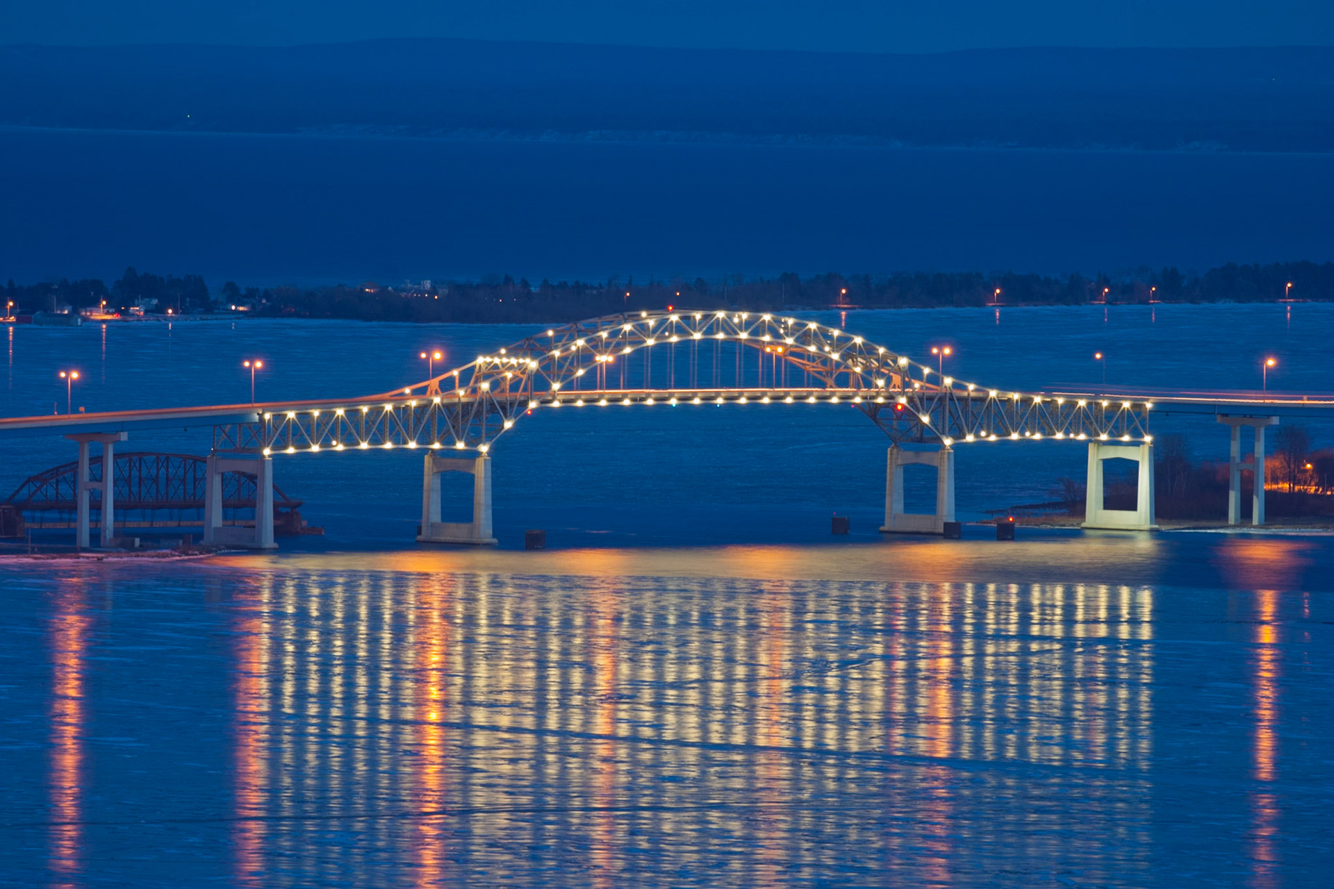 Lights of the Blatnik Bridge reflect on the ice covered St. Louis Bay.