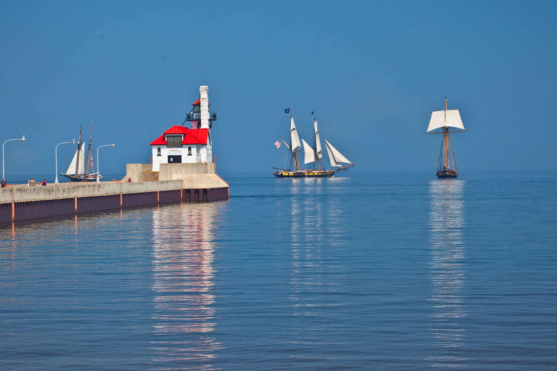 July 18— Tall Ships - Midsummer often ushers in a majestic flotilla of tall ships into port. These grand sailing vessels, a sight to behold, gather at the Head of the Lakes and embark on a summer of exploration, touring other ports around the Great Lakes."He calmed the storm to a whisper and stilled the waves. What a blessing was that stillness as he brought them safely into harbor!" - Psalm 107:29-30Summers are short in the Northland, so take advantage of every day.