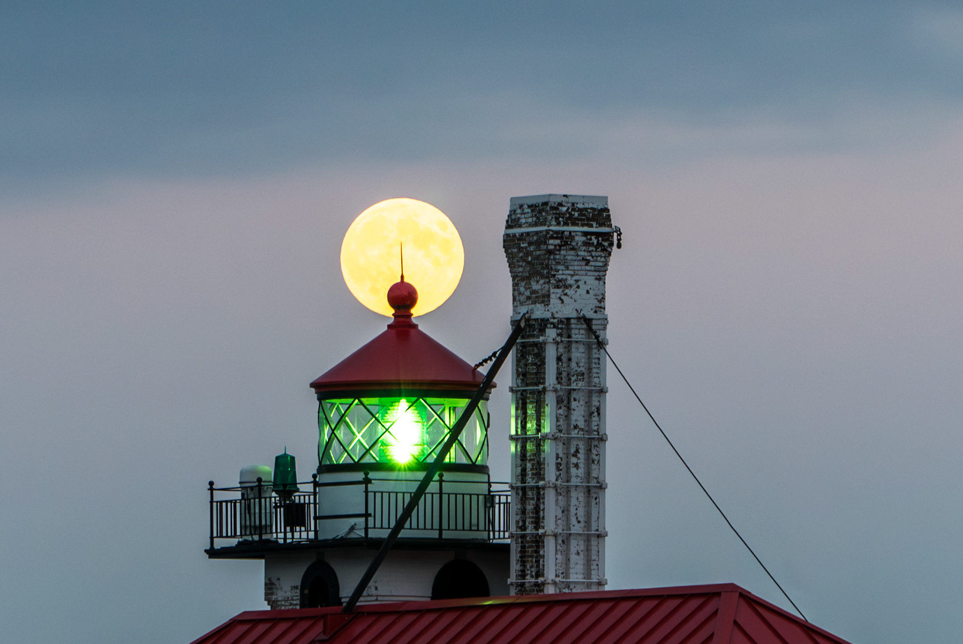 September 16 - Full Harvest Moon - The Lantern Room of the South Pier pokes the full moon of September as it passes through the sky.The timing of the lighthouse flashes is meant for ships to identify them, and the timing of the moonrise is intended for us to know the creator of the universe."While the earth remains, seedtime and harvest, cold and heat, summer and winter, day and night, shall not cease." - Genesis 8:22