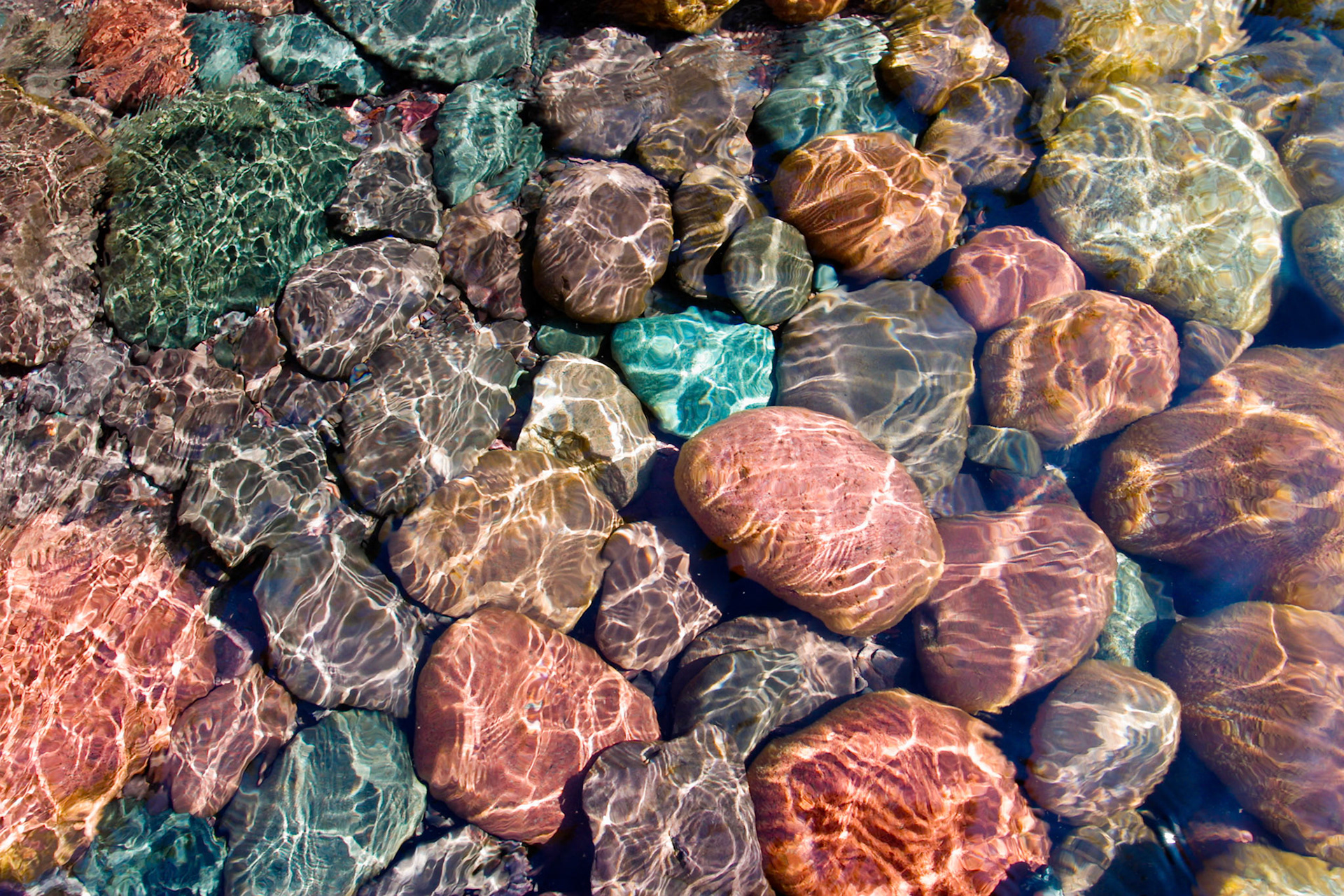 May 12 - Wave Design - Sunlight reflecting through the clear crystal clear waters of Lake Superior, make endless designs on the rock below.This hidden beach on the North Shore is a perfect place to rest and reflect on the goodness of God.  I hope you can do the same right now as you view the reflecting light beams.