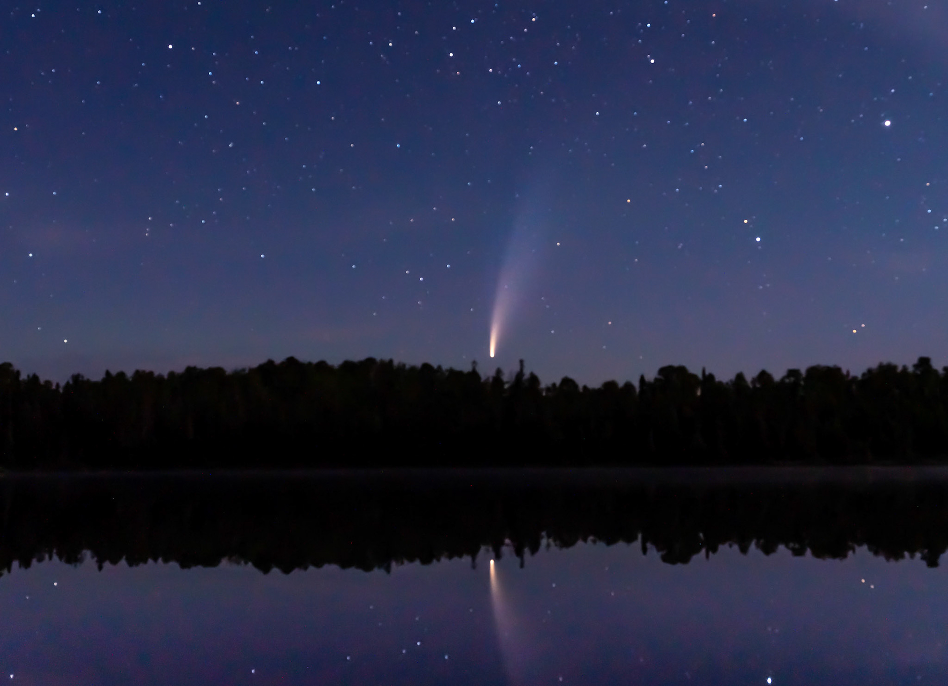 July 13 - Comet Neowise - Streaking through the night sky, comet Neowise casts a reflection into a quiet lake in a 2 am fly-by earth.Comets are cosmic balls of ice, gases, rock, and dust that orbit the Sun. Occasionally, they are visible from Earth. Neowise will return in 6800 years!Every object in the night sky reveals the glory of God in absolute truth and clarity.By faith, we understand that the universe was created by the word of God so that what is seen was not made out of things that are visible. Hebrews 11:3