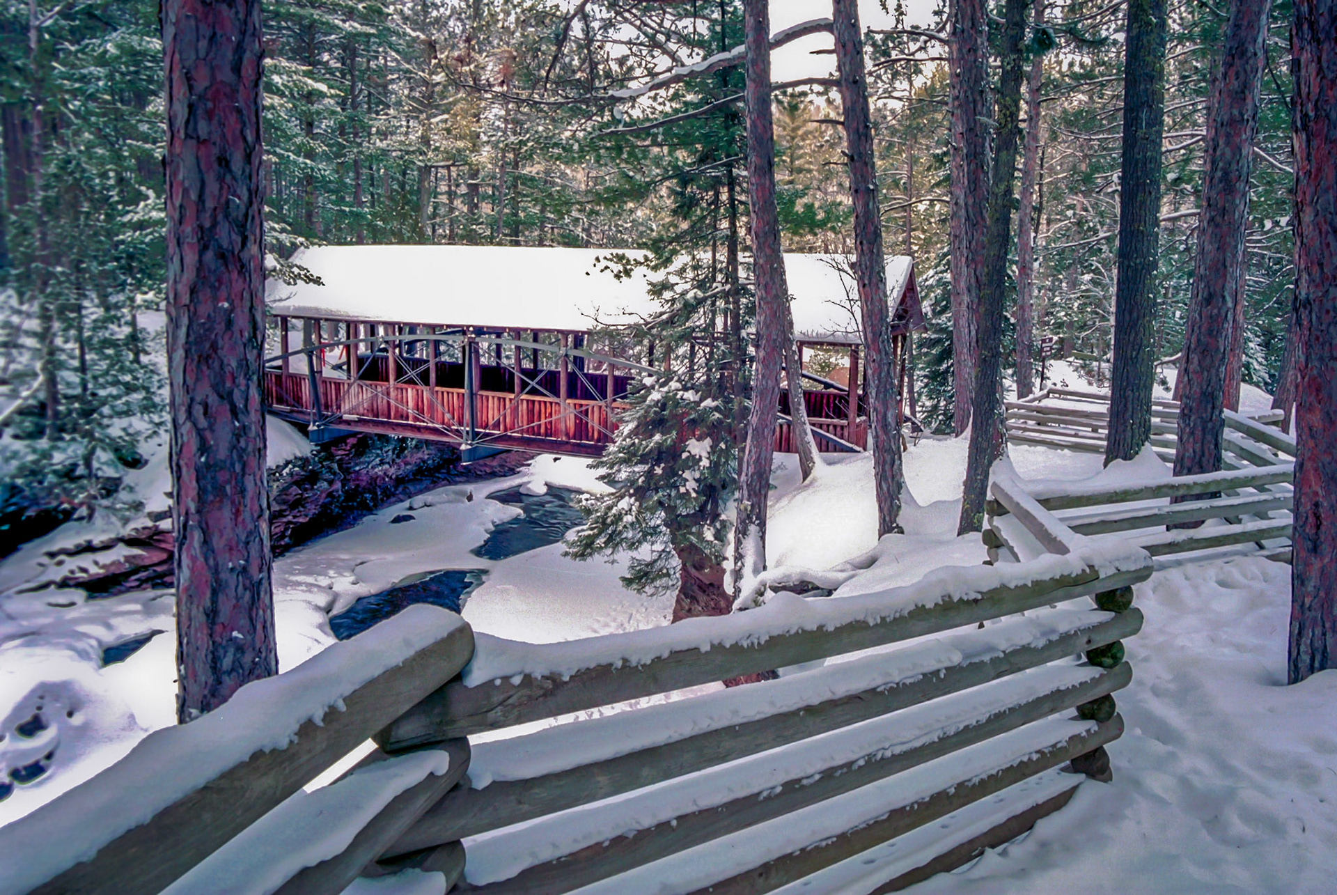January 13 - Bowstring BridgeThe Bowstring Bridge, also called a Horton Bridge, spans the Amnicon River and graces Amnicon State Park's landscapes near Superior, Wisconsin.The sound of running water, chirping chickadees, and a gentle wind blowing through the treetops gives you a sense of peace that only being in nature can provide.Let the field exult and all that is in it.Then all the trees of the forest will sing for joy. Psalm 96:12Thank you, Lord, for your exquisite creations that so often point directly to You!