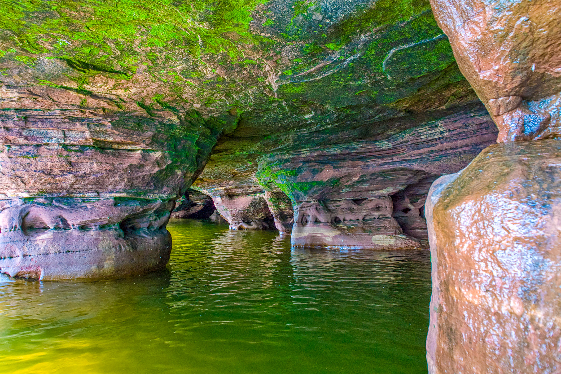 July 8—Emerald Waters—The Apostle Islands sit just offshore from the Bayfield Peninsula on Lake Superior. Sandstone erosion has carved out sea caves that can be visited by boat during the summer and cross-country skis during colder winters. The caves are one of the region's wonders and give new meaning to "Heaven on Earth." He maketh me to lie down in green pastures: he leadeth me beside the still waters. Psalms 23:2What a wonderful thought: the God of the universe cared for us so much that he led and inclined us into his loving care. Often, despite ourselves.