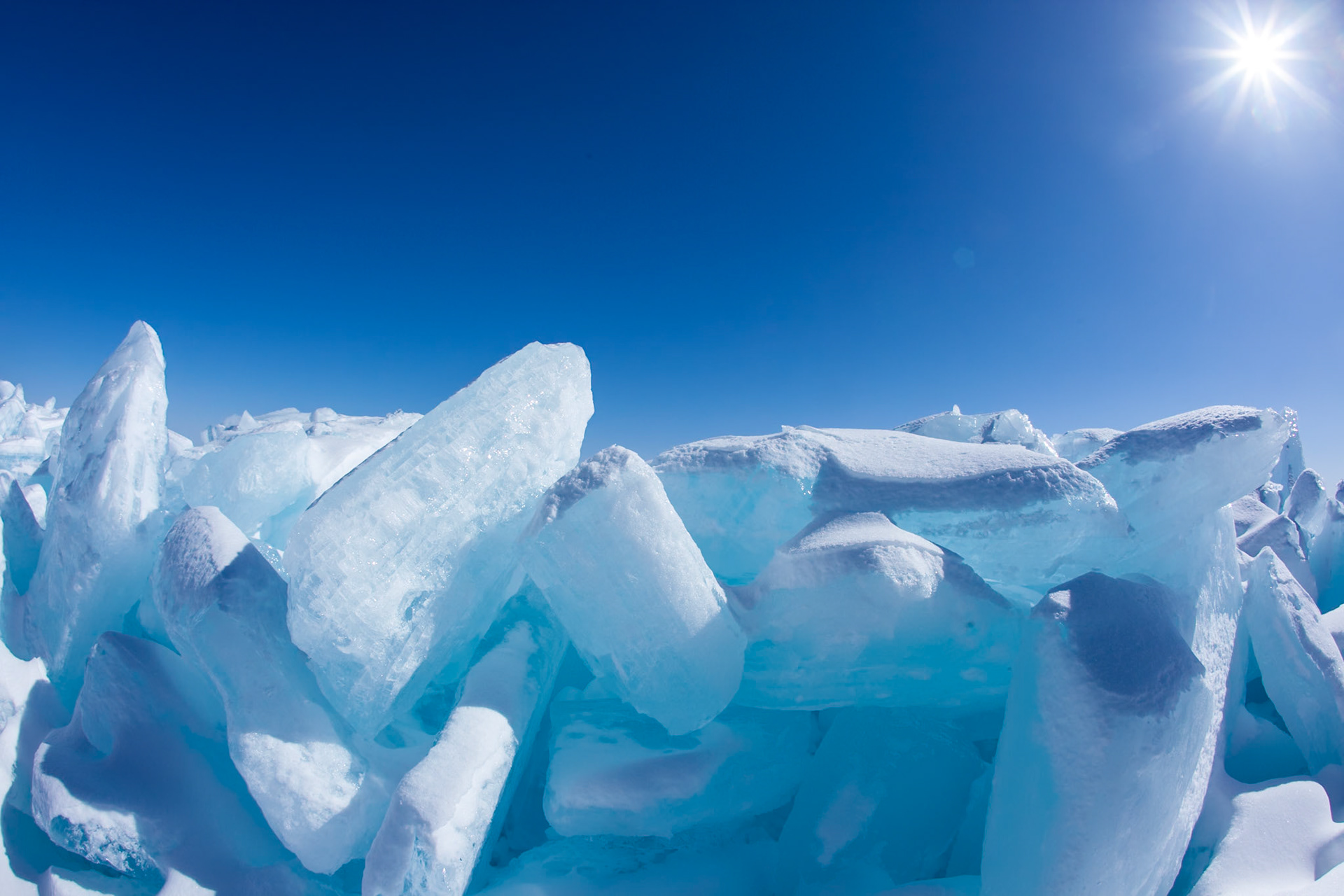 March 13 - Cold BlueSpringtime ice formations along the north shore of Lake Superior are fascinating works of art and a sure sign of Spring.The ice ridges often get pushed up onto the shore, sometimes overnight, and you can usually watch the large ice chunks moving against each other as they pile high.Ice appears blue because it absorbs more red and yellow light than other colors in the visible spectrum. When sunlight hits the ice, the blue light is transmitted and scattered in all directions, making the ice appear blue to our eyes. For this reason, deep bodies of water often appear blue.For you, O Lord, are my hope, my trust, O Lord, from my youth. Psalm 71:5A refreshing part of early Spring is looking forward to the next six months of warmth and long daylight hours.