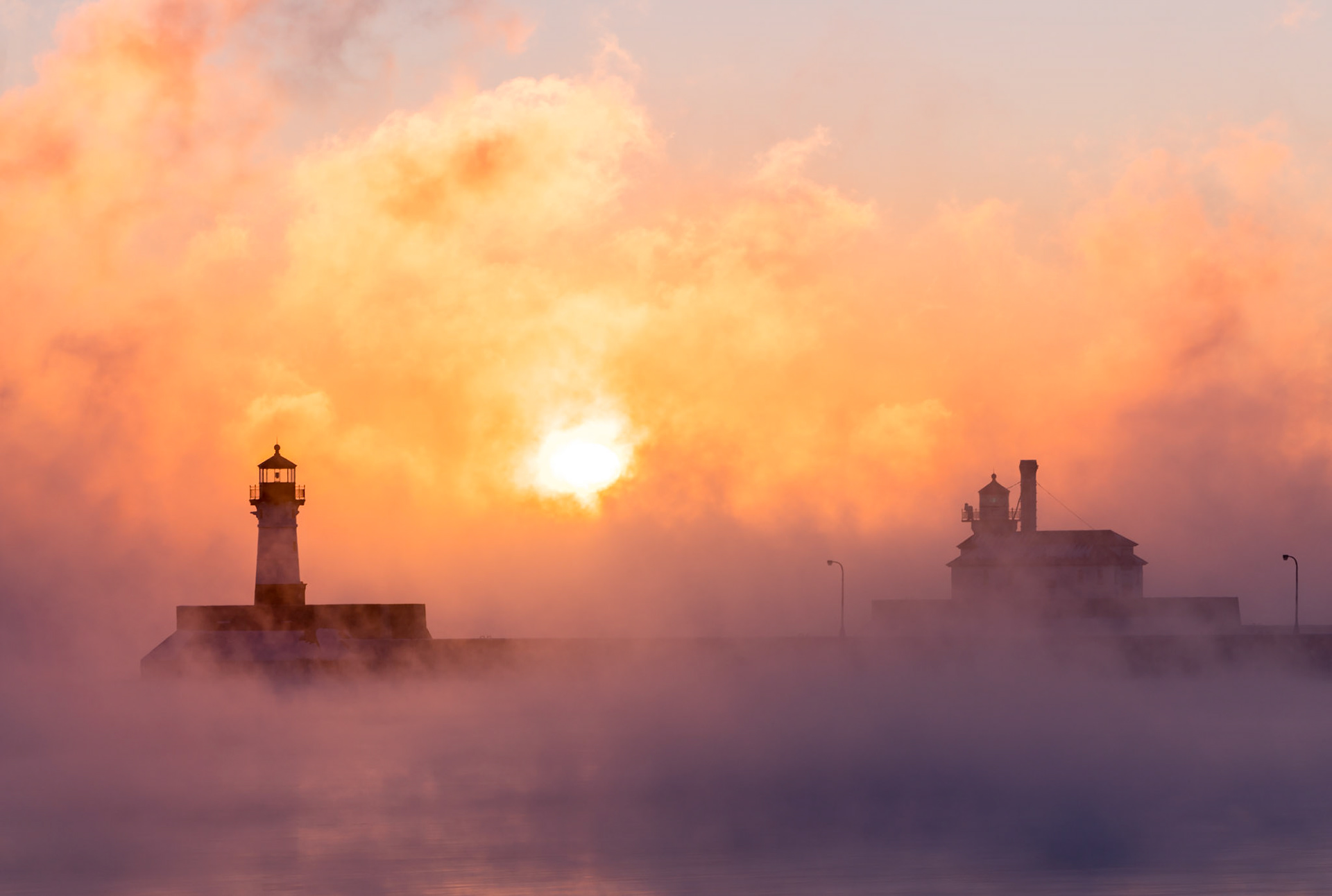 December 27th - Sea Smoke Sunrise-22F produces magnificent scenery around Lake Superior, and the lighthouses enhance the beauty of the Duluth Shipping Canal.It is truly amazing to witness the natural beauty that surrounds us and to appreciate the wonders of creation, as described in the book of Genesis.And God said, “Let there be lights in the expanse of the heavens to separate the day from the night. And let them be for signs and for seasons, and for days and years... Genesis 1:14