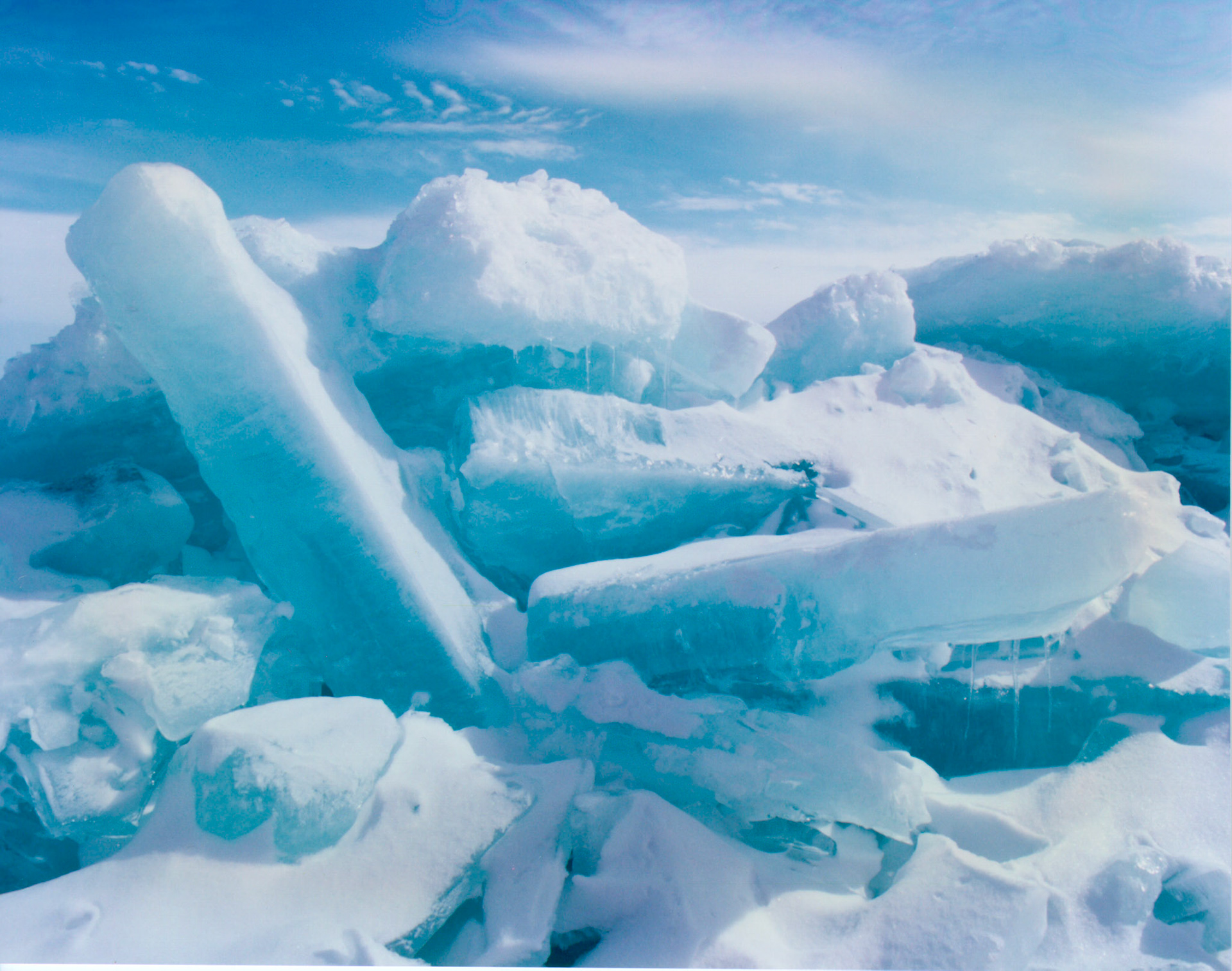 During late winter, ice embraces the shores of Lake Superior like a necklace. The beauty of this natural wonder adds a quiet white finishing touch to the never ending glory of Gods creation.