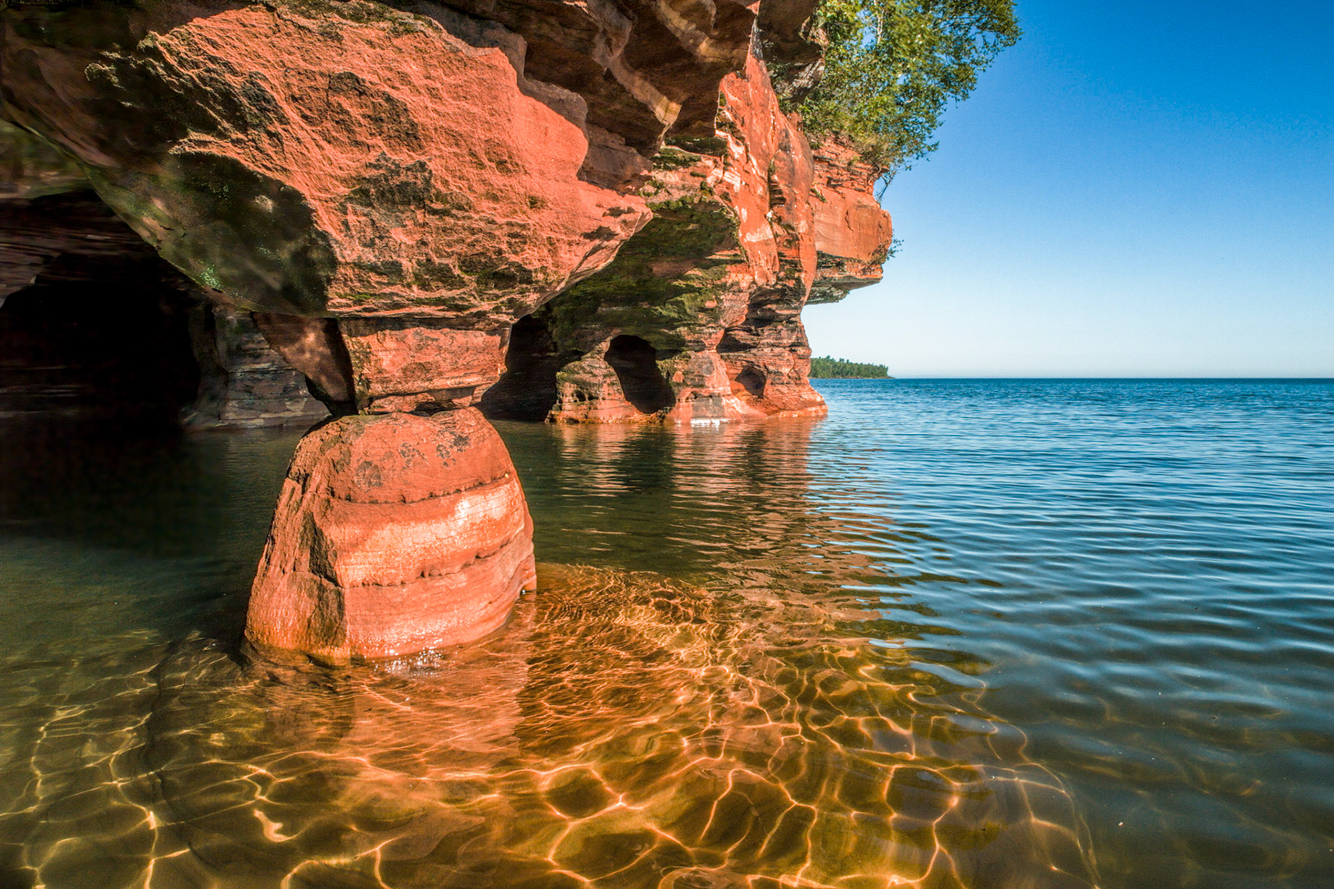 August 22-Sand Island LighthouseThe Sand Island Lighthouse, a striking structure near the western end of the Apostle Islands, was built in 1881. This charming lighthouse, made from sandstone quarried on-site, is a beautiful landmark on Lake Superior and a crucial guide for ships navigating the treacherous waters. It is a testament to the architectural and engineering marvels of its time."The light shines in the darkness, and the darkness has not overcome it." - John 1:5 The lighthouse keepers were diligent about keeping the light lit at night. So is our God diligent about the light of salvation.