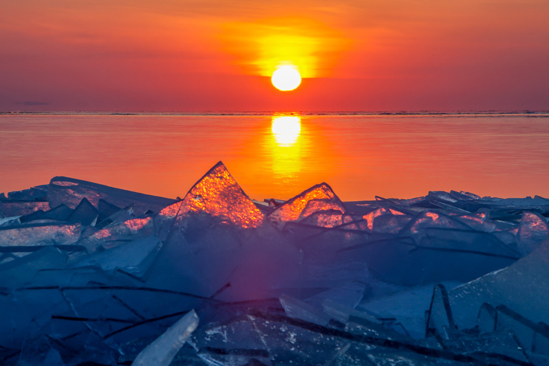February 11 - Superior Glow Each season on Lake Superior has its unique beauty, and as February represents the waning winter season, shore ice is a distinctive feature with a beauty all its own.The strengthening afternoon sun breaks the surface ice formed overnight into shards of crystal, and winds and waves pile it high on the shore.The temporary icy sheets form a necklace around Lake Superior's shores, a reminder of the quickly changing seasons in this short snapshot of time.May your unfailing love be with us, LORD, even as we put our hope in you. Psalm 33:22We are blessed today to have another day to slow down and consider God's glory in his creation and the quick and sure passing of time.
