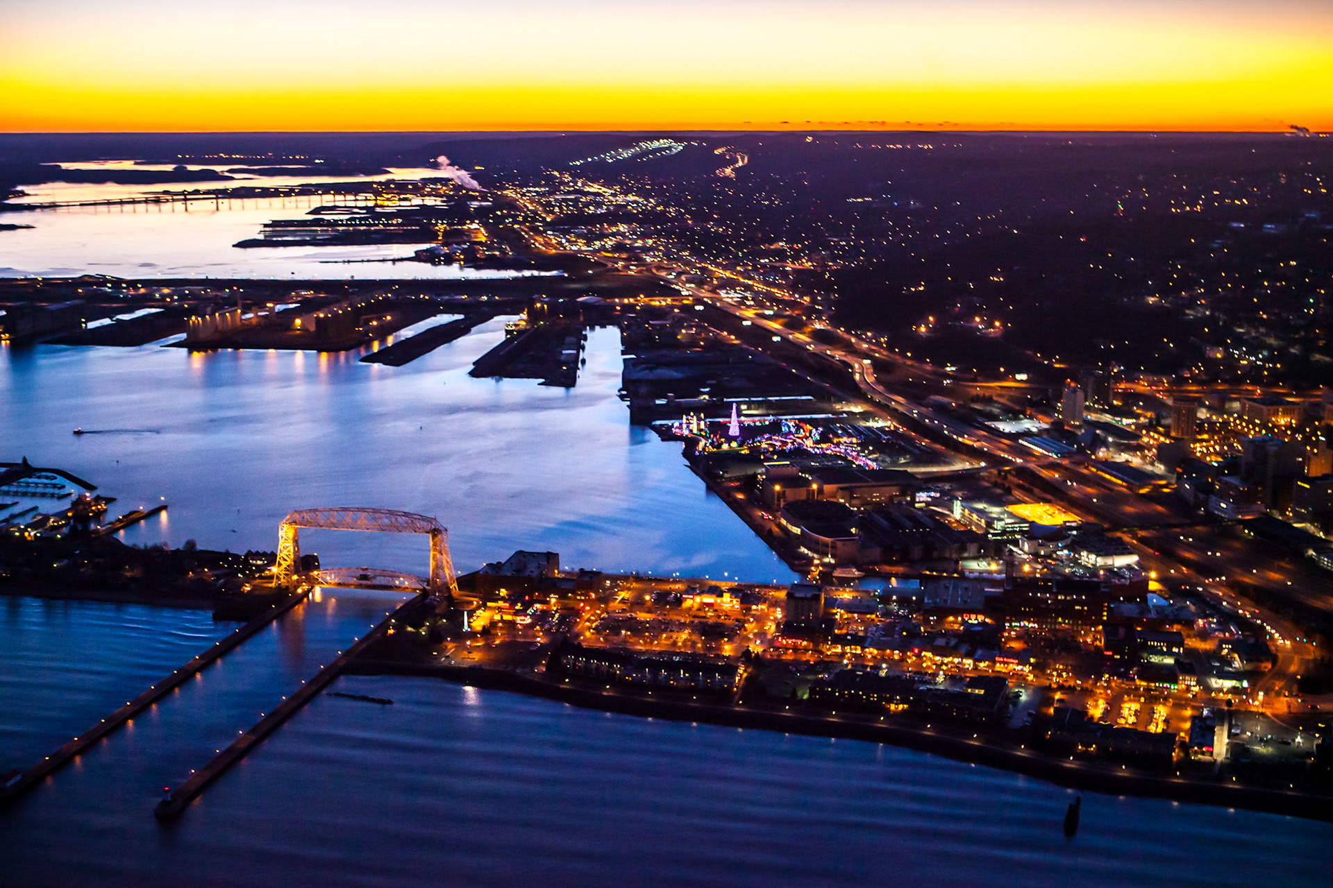 November 3 - Twilight CityThe long November nights also bring extended twilight hours, which hold onto the light of day for an extra few moments of enjoyment.With the leaves gone now, everyone awaits the first-lasting snowfall with anticipation.Rejoice in hope, be patient in tribulation, be constant in prayer. Romans 12:12