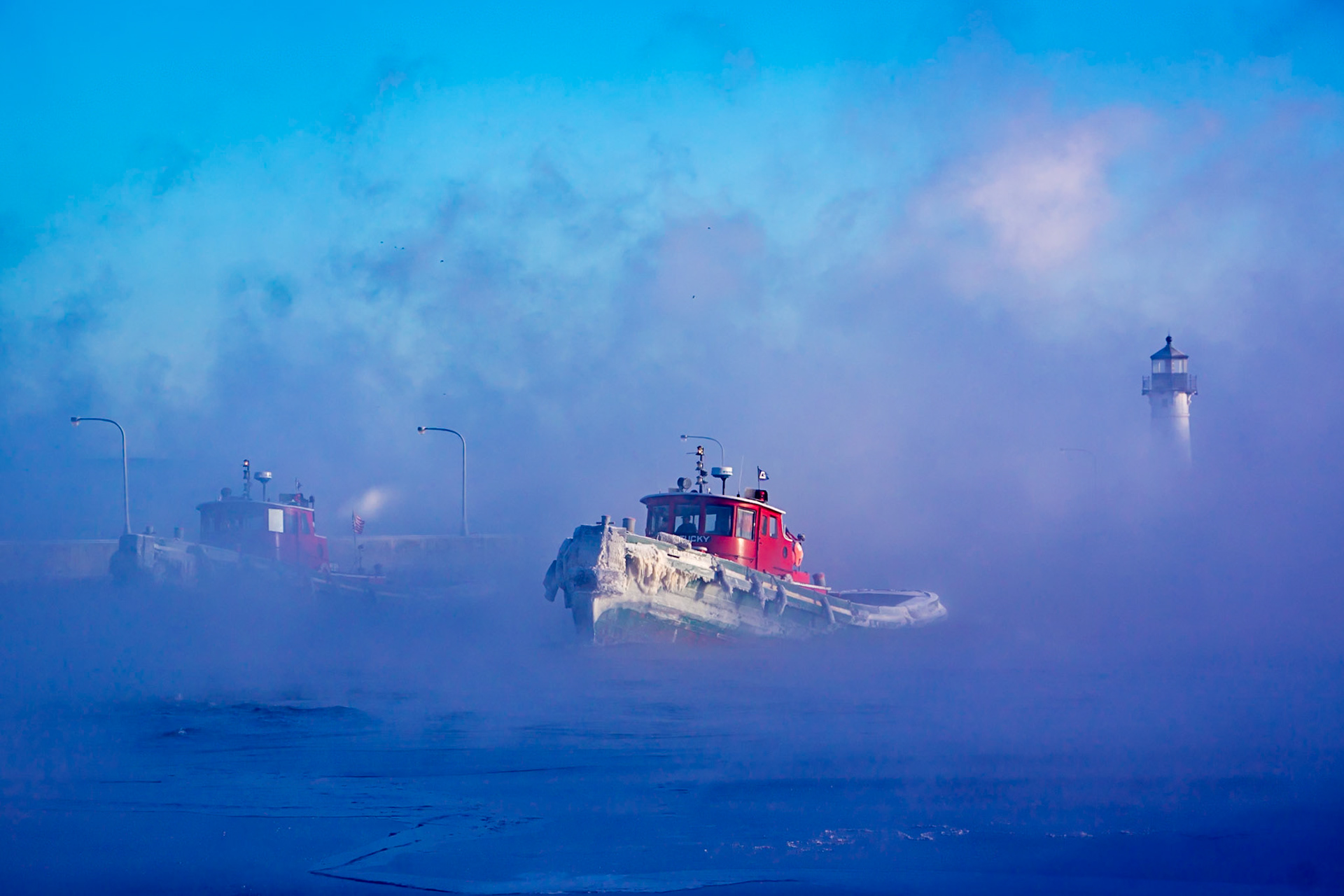 January 6th - Ice Tug FormationSea smoke drifts across the Duluth Shipping Canal as ice-covered tugboats motor through the icy waters. Their red hulls emerge from the cold fog after escorting a laker onto Lake Superior for its final crossing of the season. Steel meets ice, and the cold bites your fingers as soon as you take off your gloves to adjust the camera settings.The final week of the Great Lakes shipping season demands constant attention. Tugboats, as well as the CGC Spar, work tirelessly to keep channels open, guiding vessels safely as ice forms and temperatures plunge.I’ve always admired the grit and dedication of these mariners. Working long hours in bitter cold, they quietly do the work most never see. Watching them move through steam and ice is a reminder that perseverance often happens far from applause.“Trust in the Lord with all your heart, and do not lean on your own understanding. In all your ways acknowledge Him, and He will make straight your paths.” — Proverbs 3:5–6January’s sharp air and stark beauty invite us to trust deeply, endure patiently, and remain thankful—especially in life’s most demanding seasons.