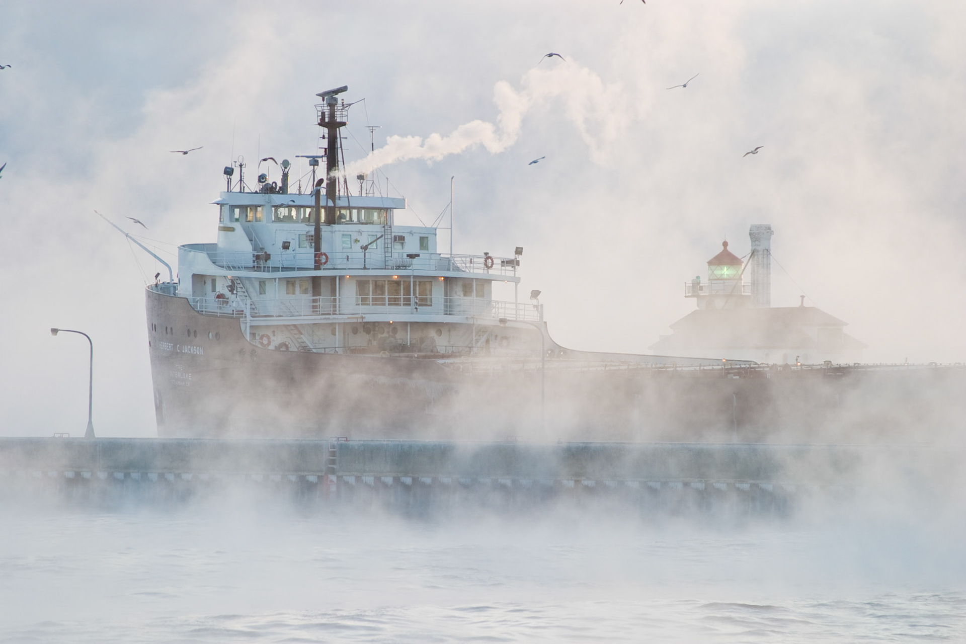 During cold winter months, ship traveling the Great Lakes appear like ghost ships as they travel through the ice fog.