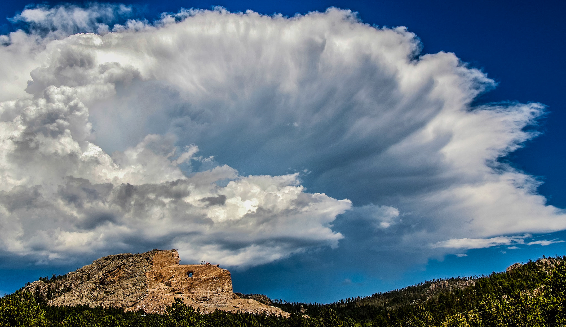 Clouds loom over the Crazy Horse monument in South Dakota