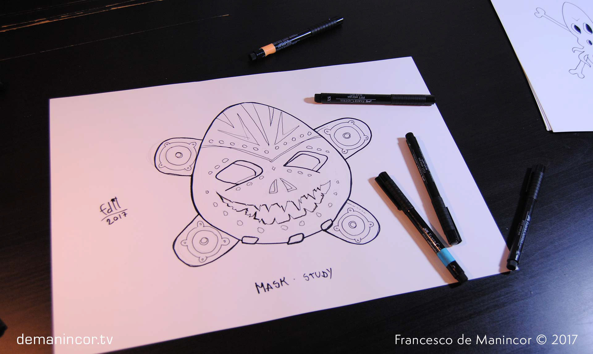 sketch of a mask with markers on paper