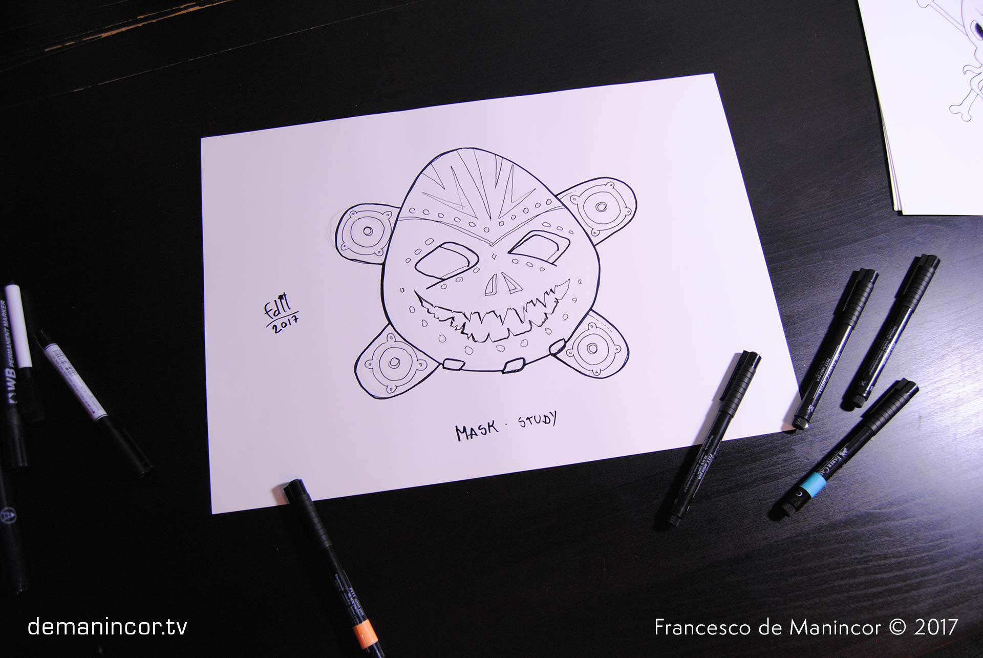 sketch of a mask with markers on paper