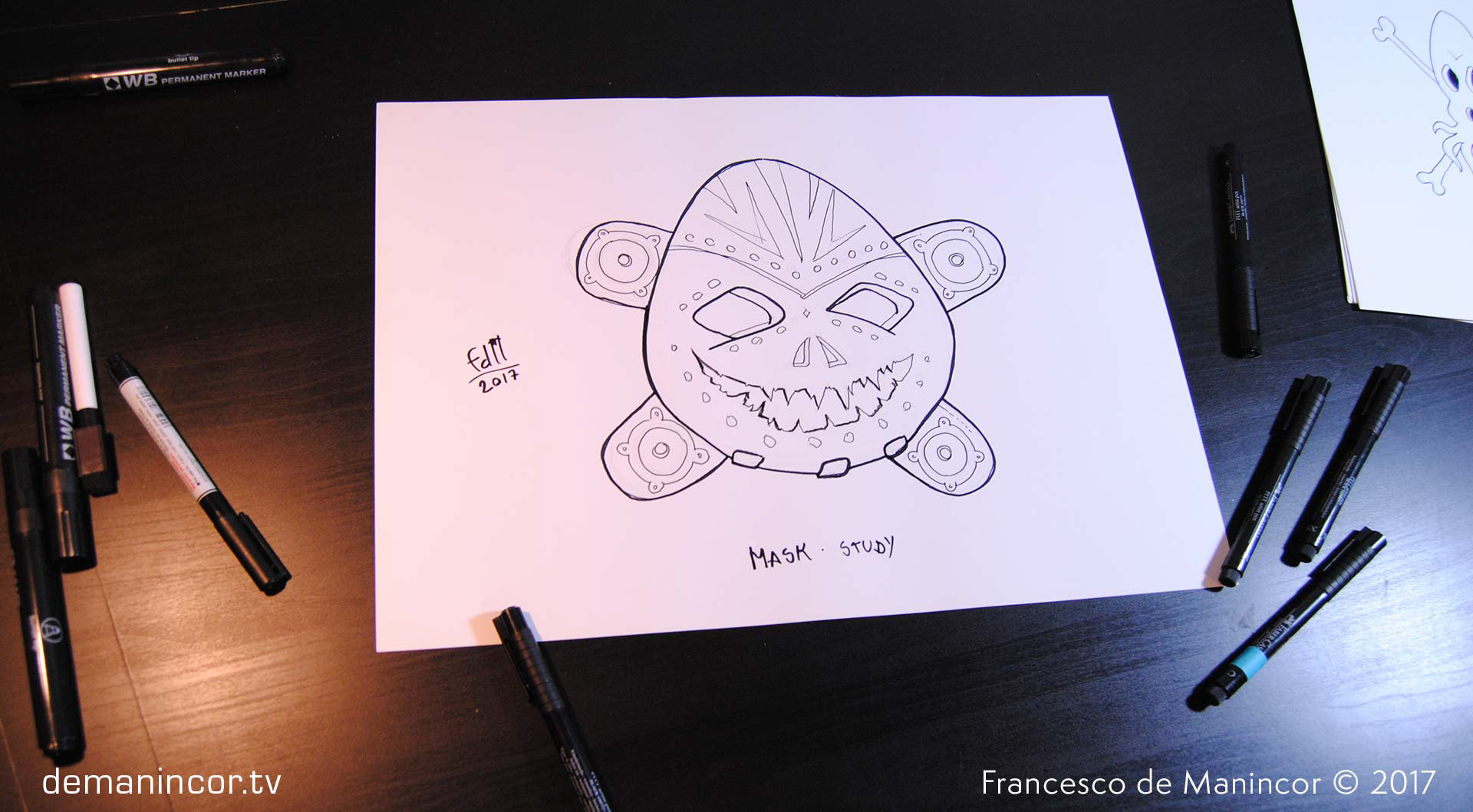 sketch of a mask with markers on paper