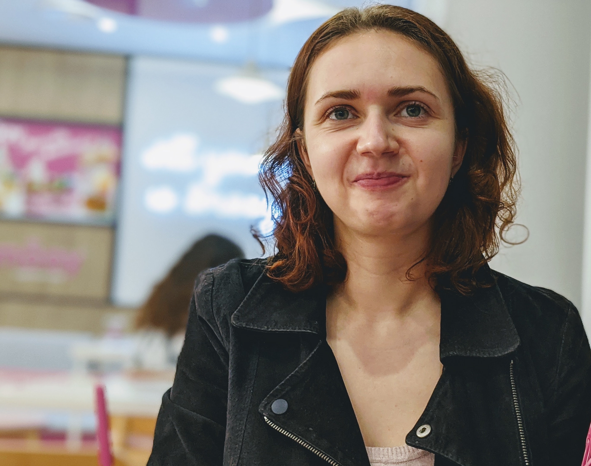 A person (gender woman) smiling