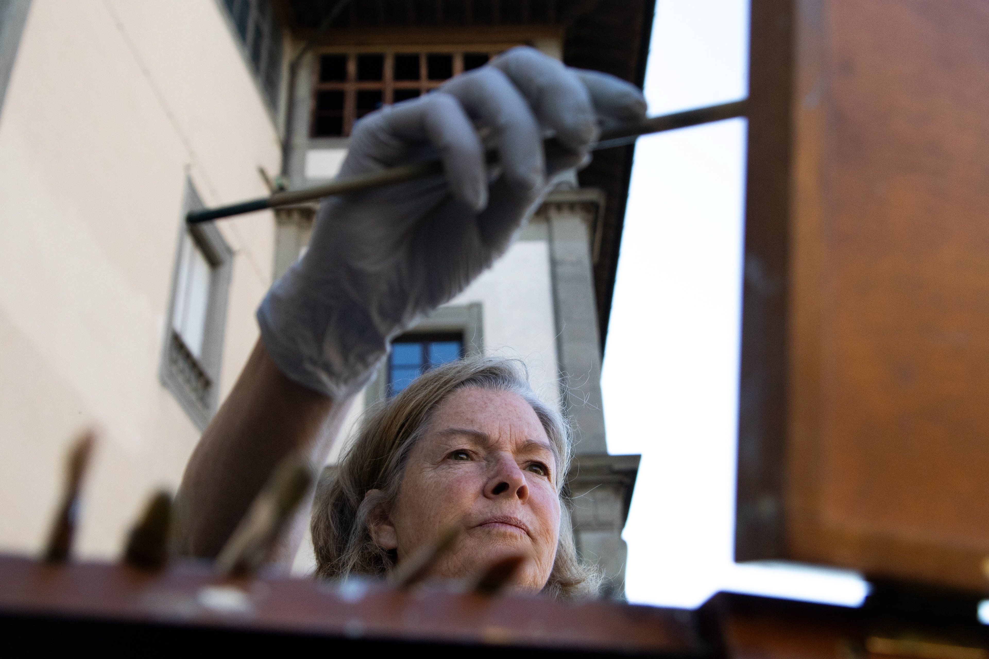 California Hartland college professor, Georgesse Gomez, paints the “Ponte Vechio” bridge in Florence, Italy on Saturday, May 31, 2025. 