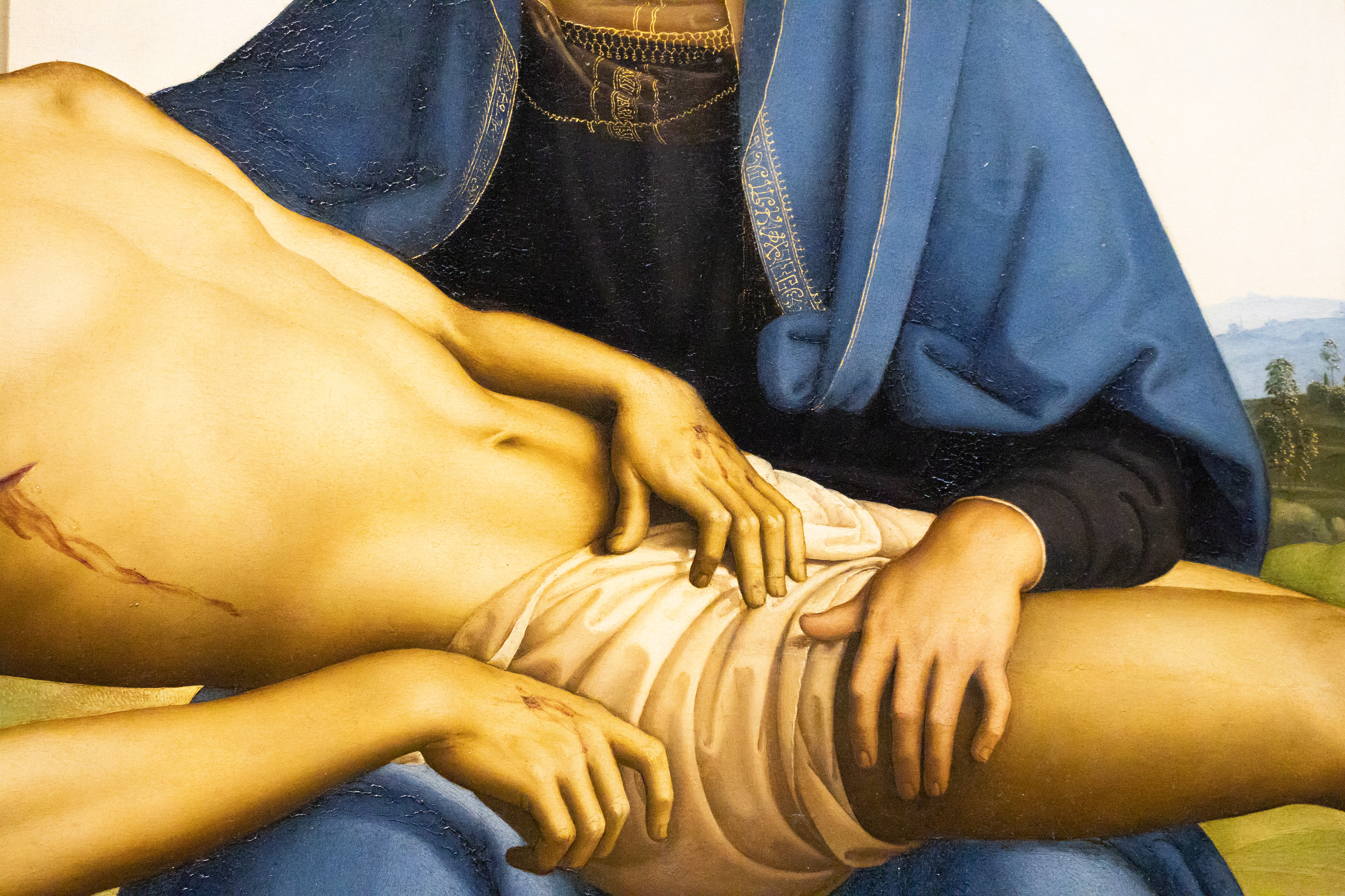 Jesus’s holes on his hands and thrash on his side from the cross and whipping he endured depicted on “Pieta” by Pietro Perugino from the Uffizzi Gallery in Florence, Italy on Tuesday, May 27, 2025. 