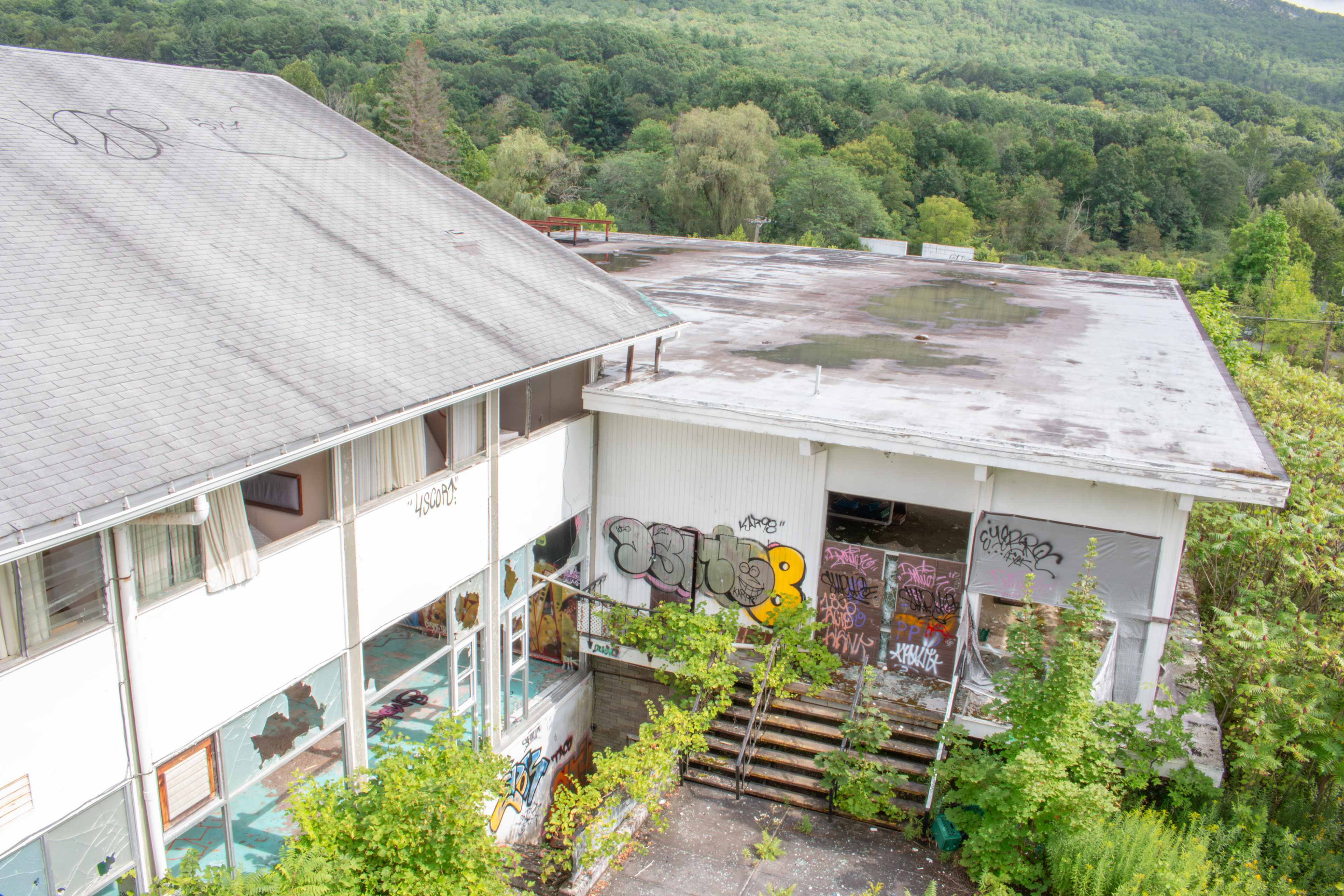 Outside of Indoor Pool Area (Left Side), Outside in the back of Main Dining Room (Right Side), 2021