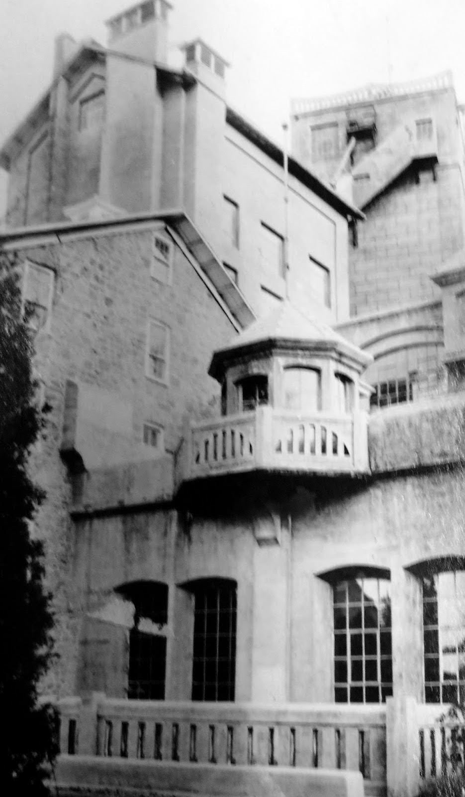Original mill (left) and the ornamental cast concrete boxes and railings on the early 20th century edition to mill