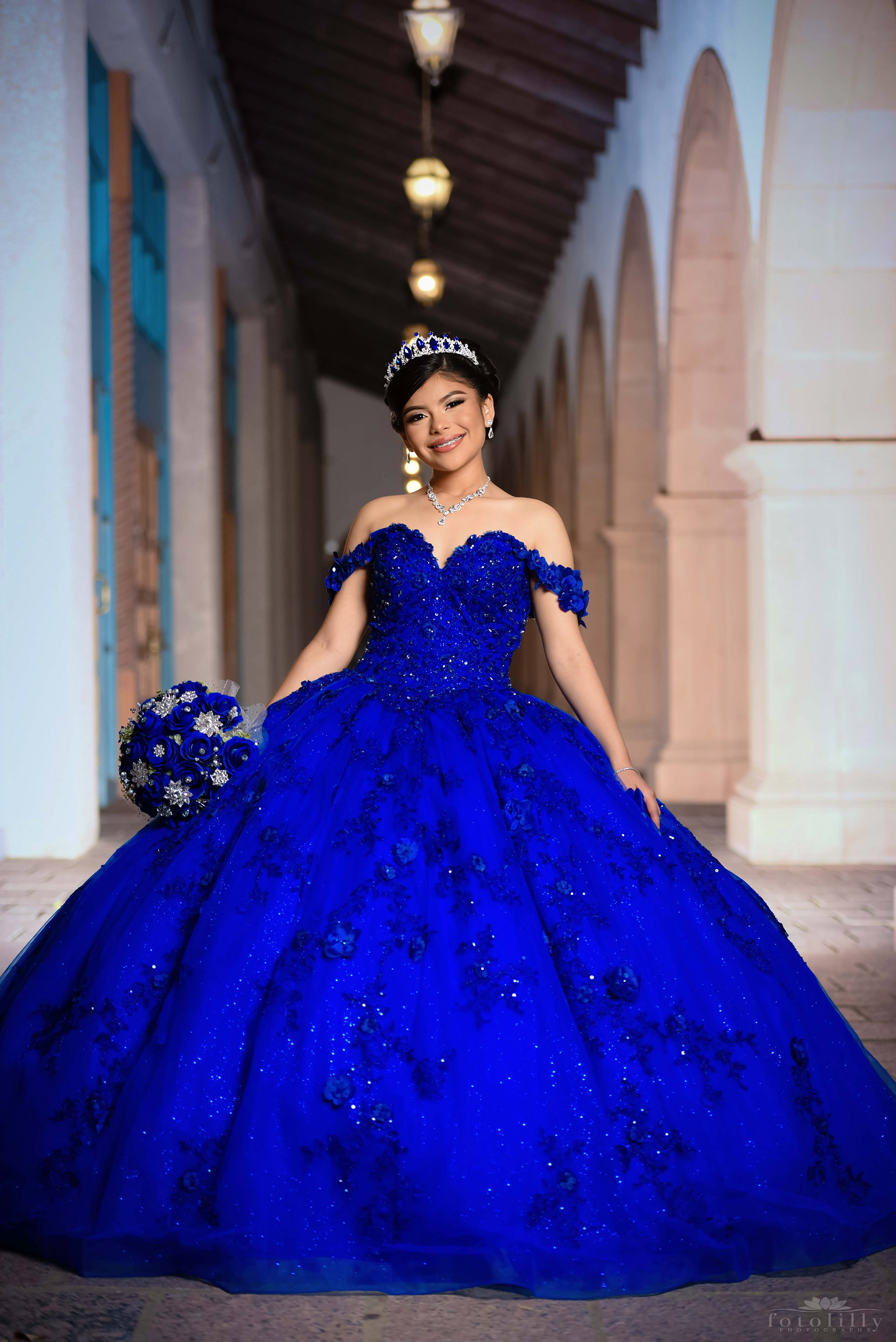 Quinceañera in a Stunning Blue Dress at a Photoshoot at the canals in Las Colinas