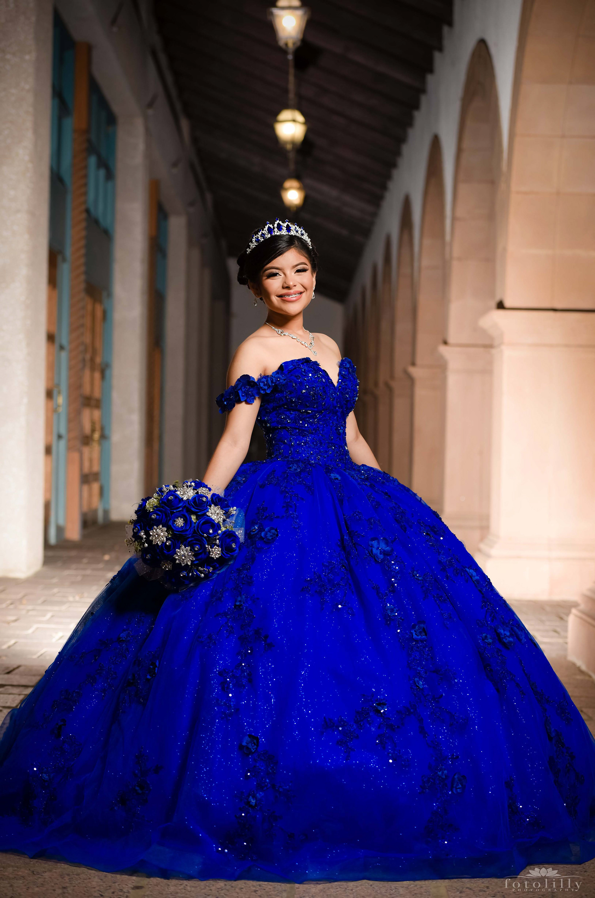 Quinceañera in a Stunning Blue Dress at a Photoshoot at the canals in Las Colinas