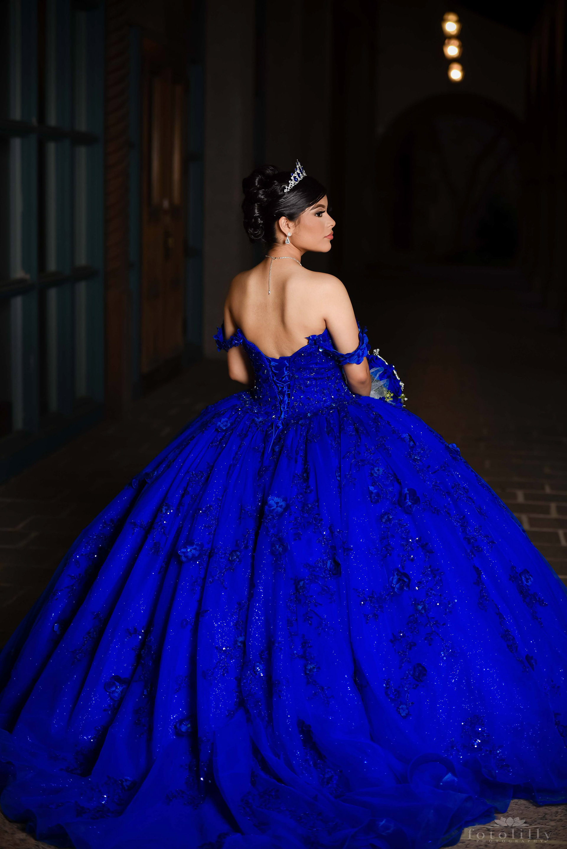 Quinceañera in a Stunning Blue Dress at a Photoshoot at the canals in Las Colinas
