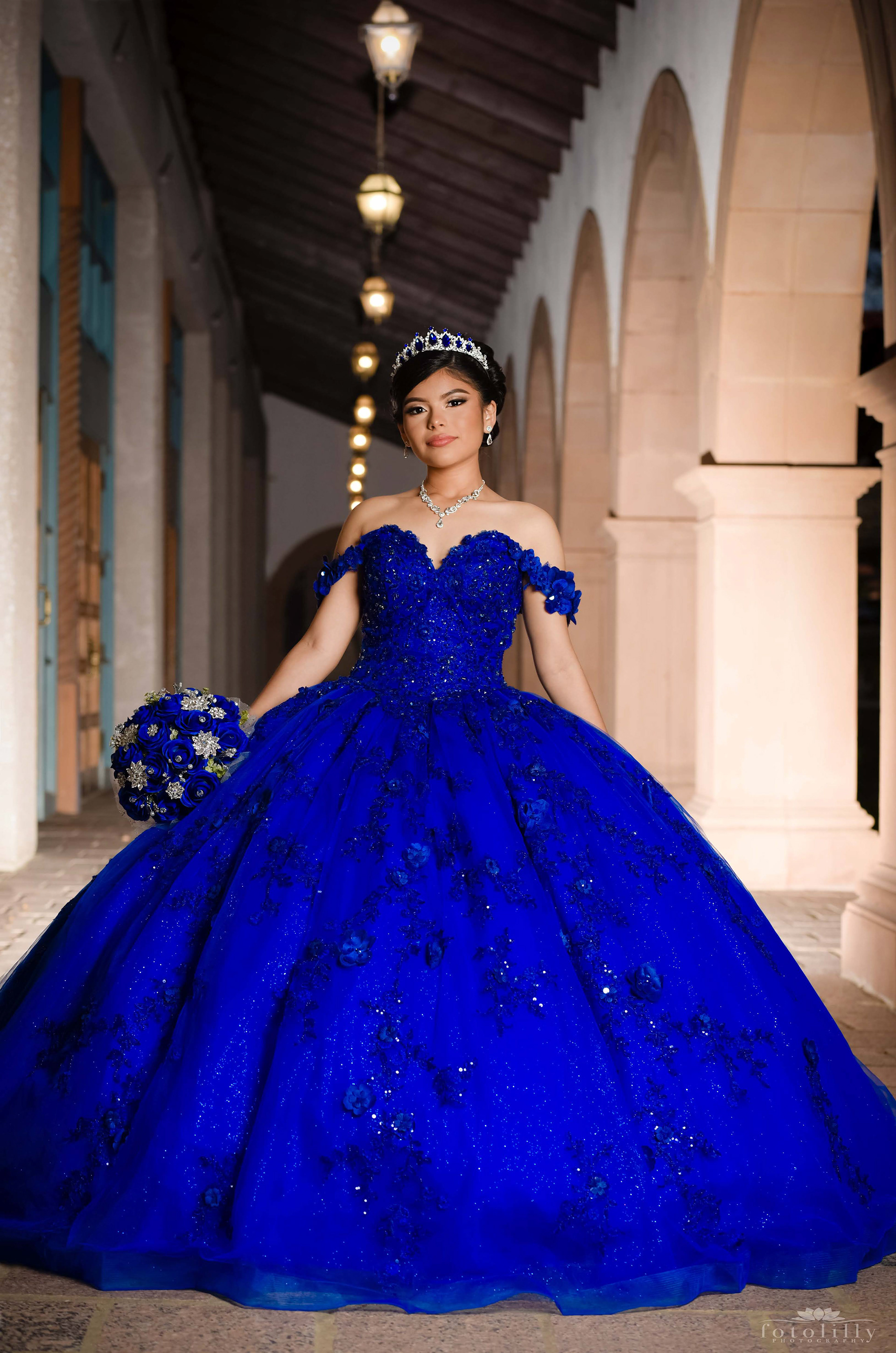Quinceañera in a Stunning Blue Dress at a Photoshoot at the canals in Las Colinas