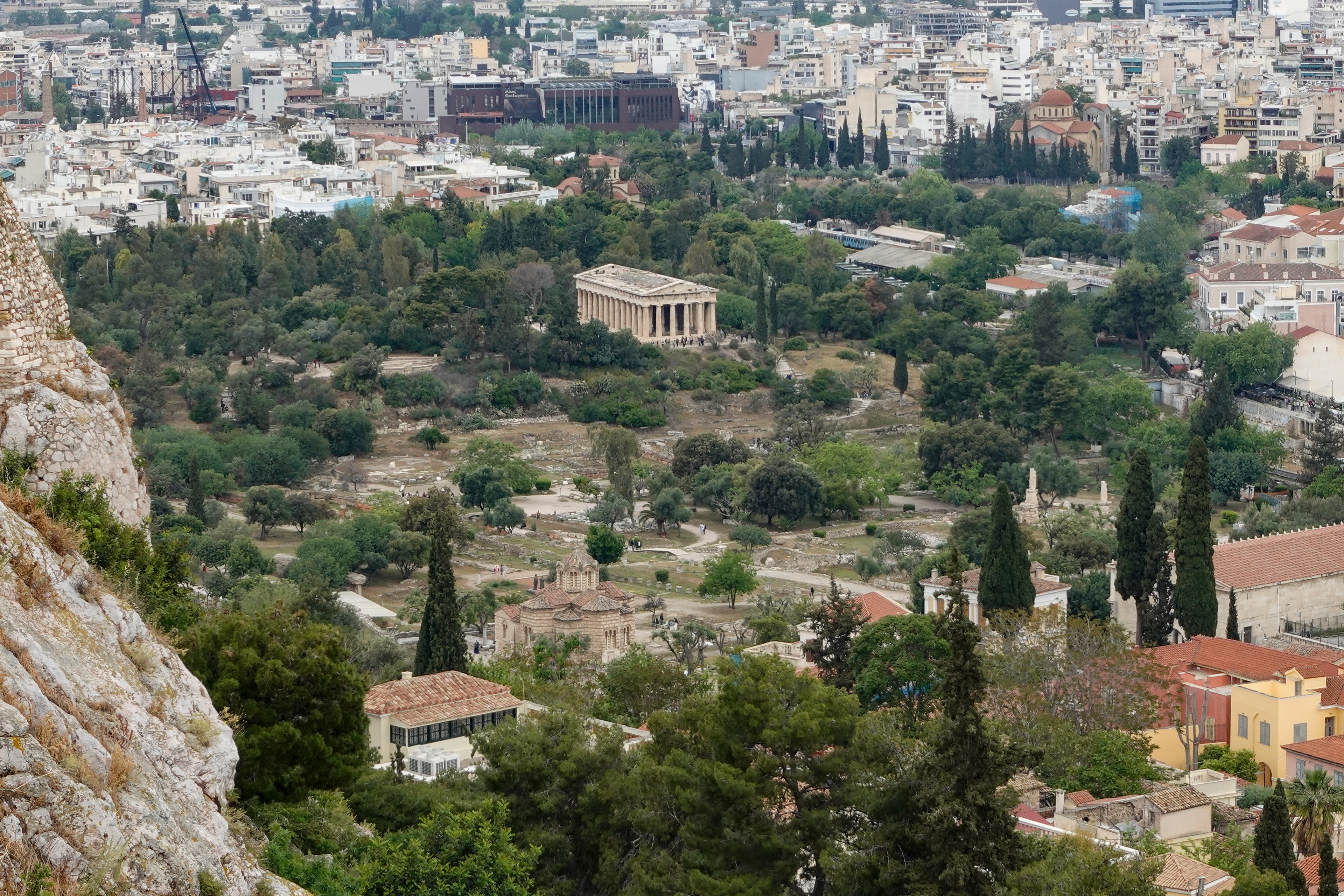 The Agora, or marketplace with shrines to Greek Gods is at the base of the Acropolis. Paul visited there in Act 17:22-32.