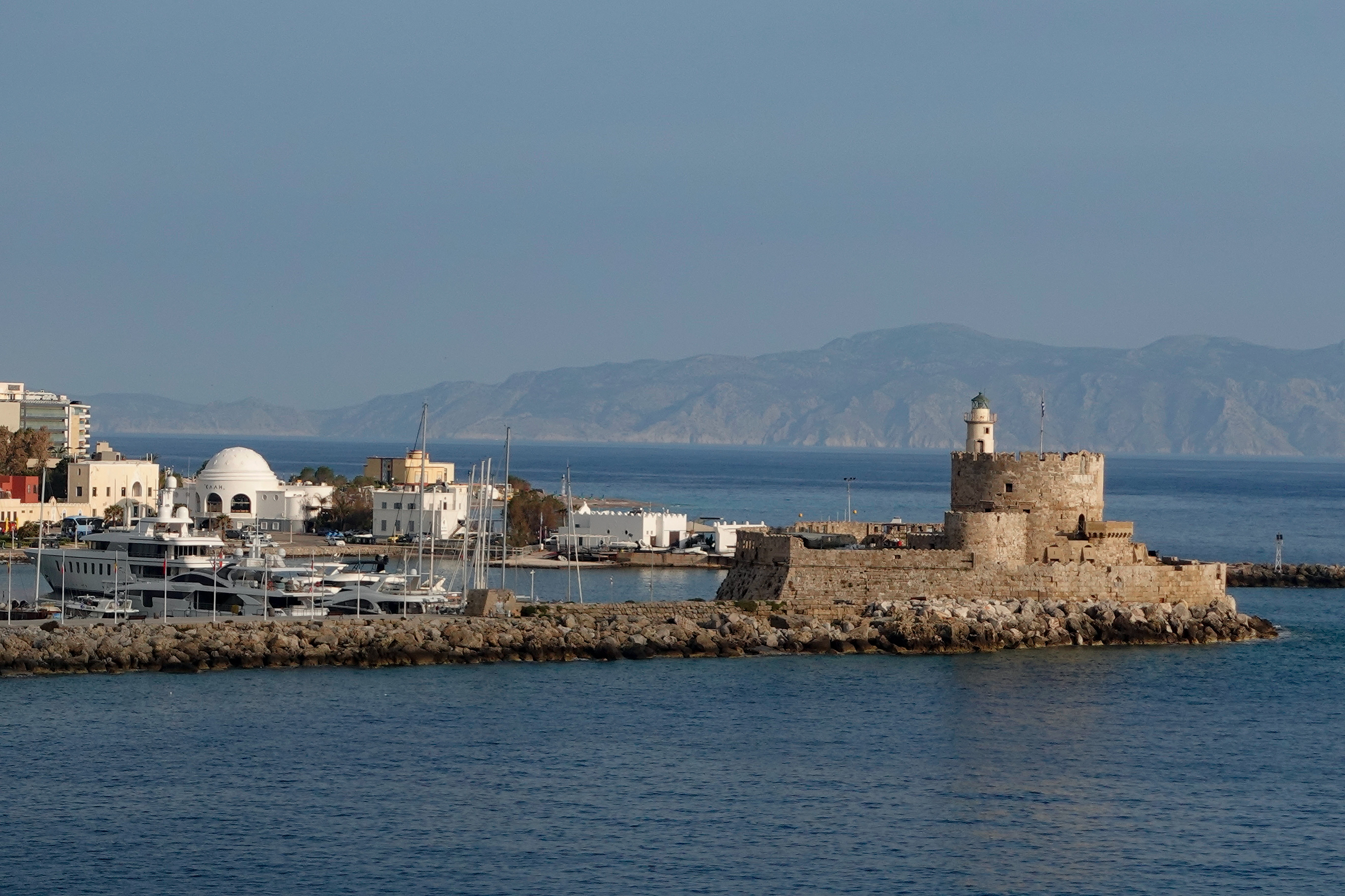 The port at Rhodes is glamorous, with the mountains of southern Turkey in the distance.