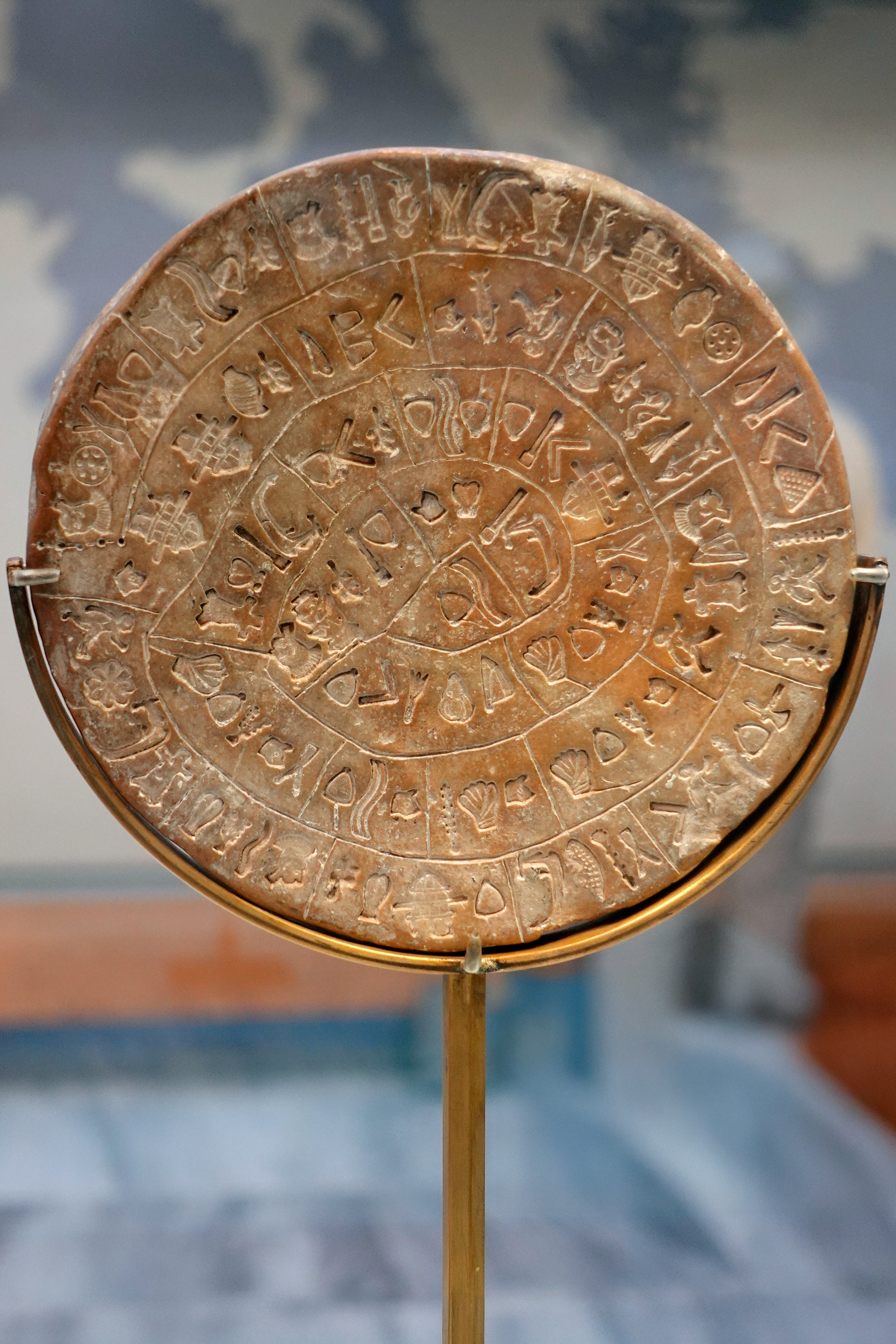 The enscribed clay Phaistos Disc dates to 17th Centery BC. It includes a spiral with pictoral signs and lines. Its meaning is unknown.
