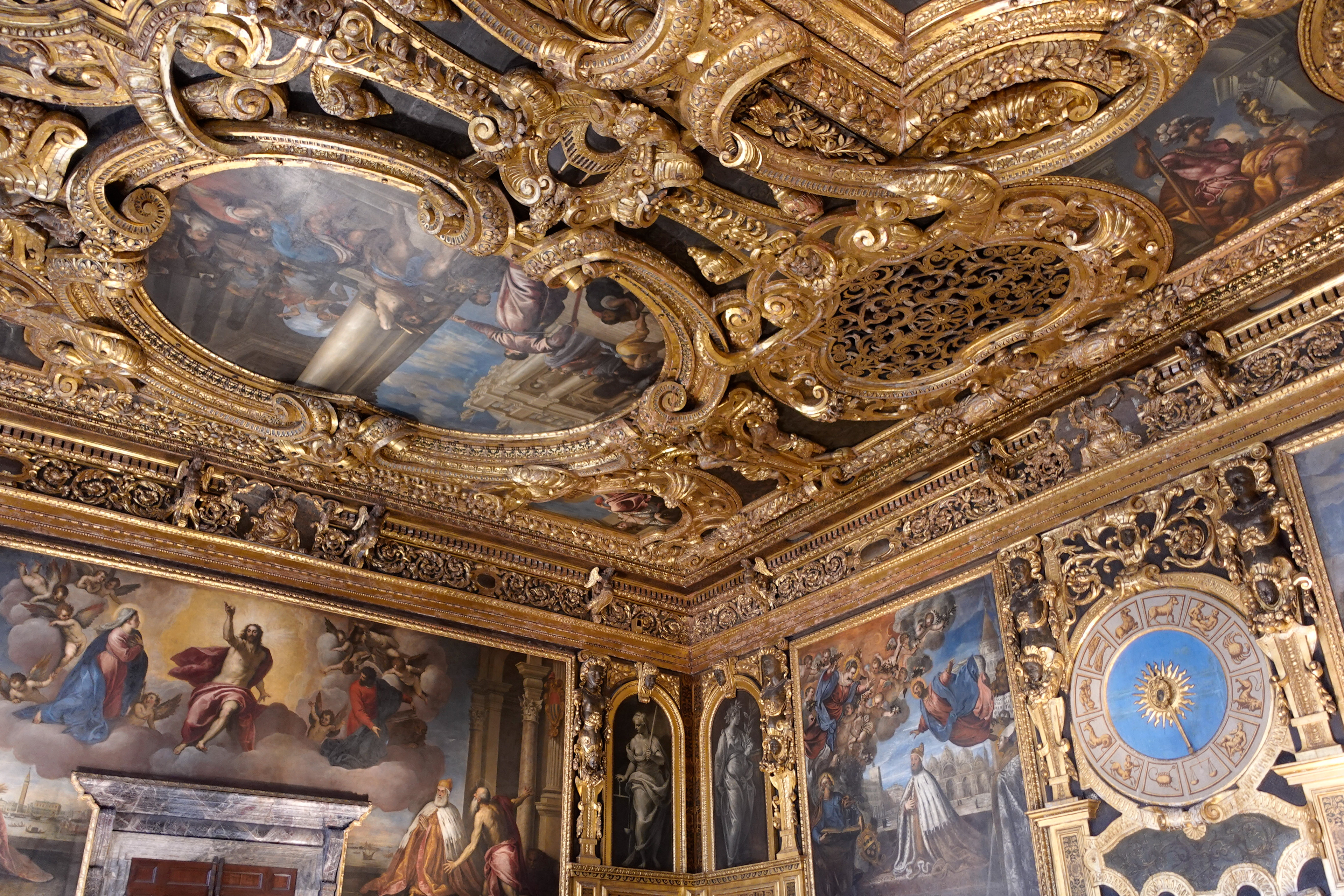 Many rooms include clocks and carved pediments over the doors.