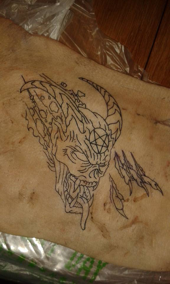 Demon head on pig skin