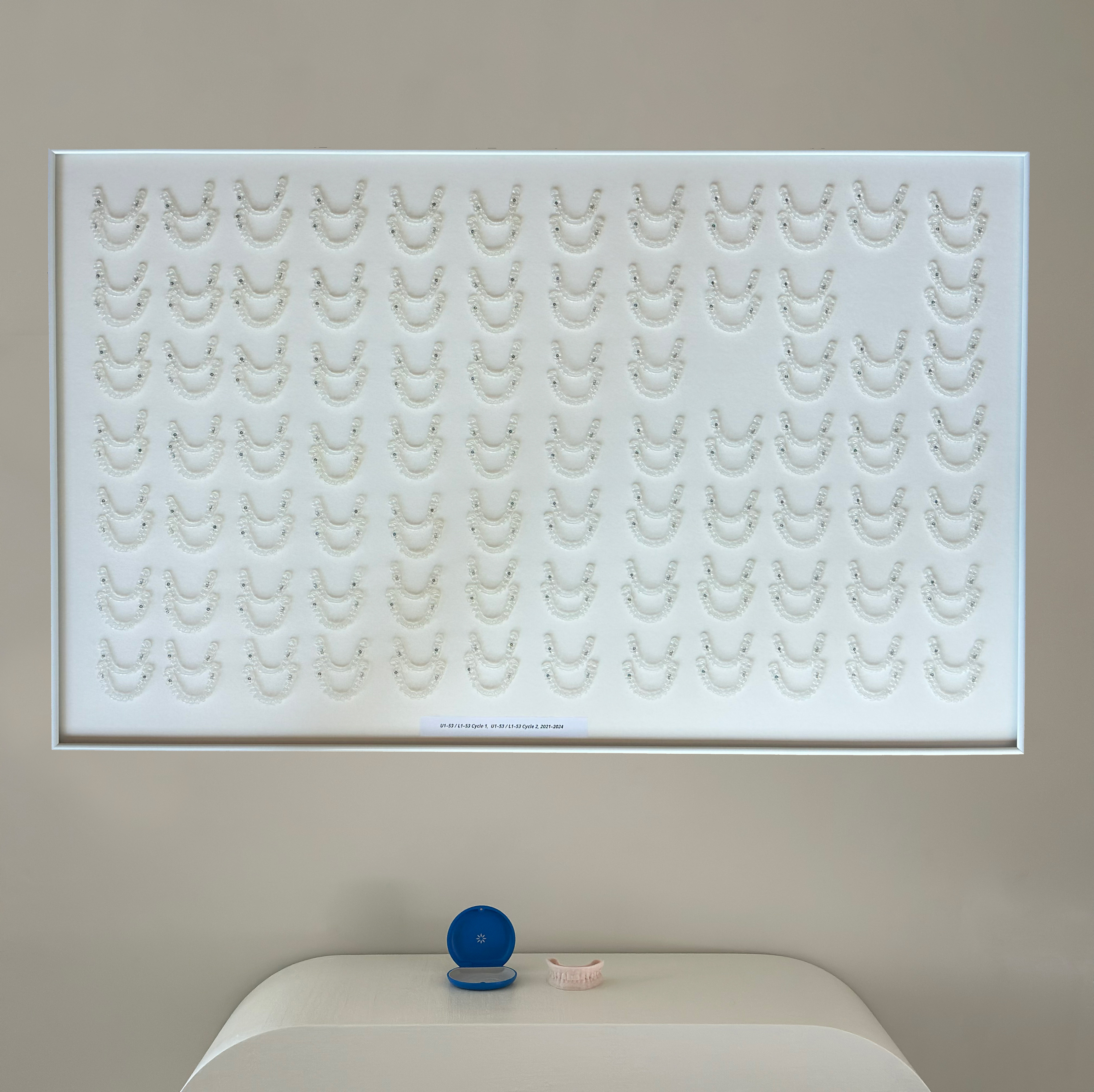 Sequence 164, 2025, Invisalign aligners, dental cast, plastic case, 36 × 40 in