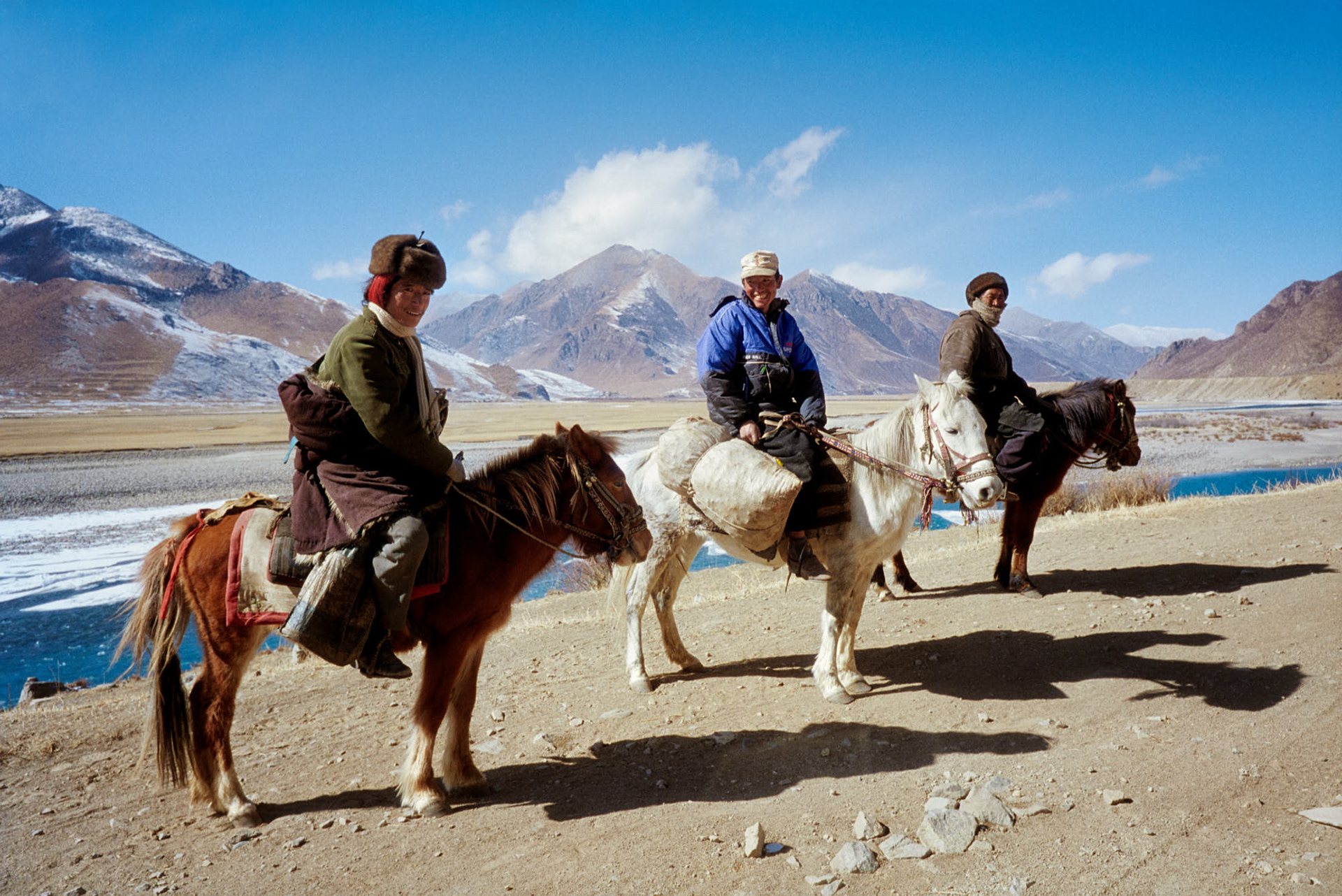 Tibet - Travelers on the road.