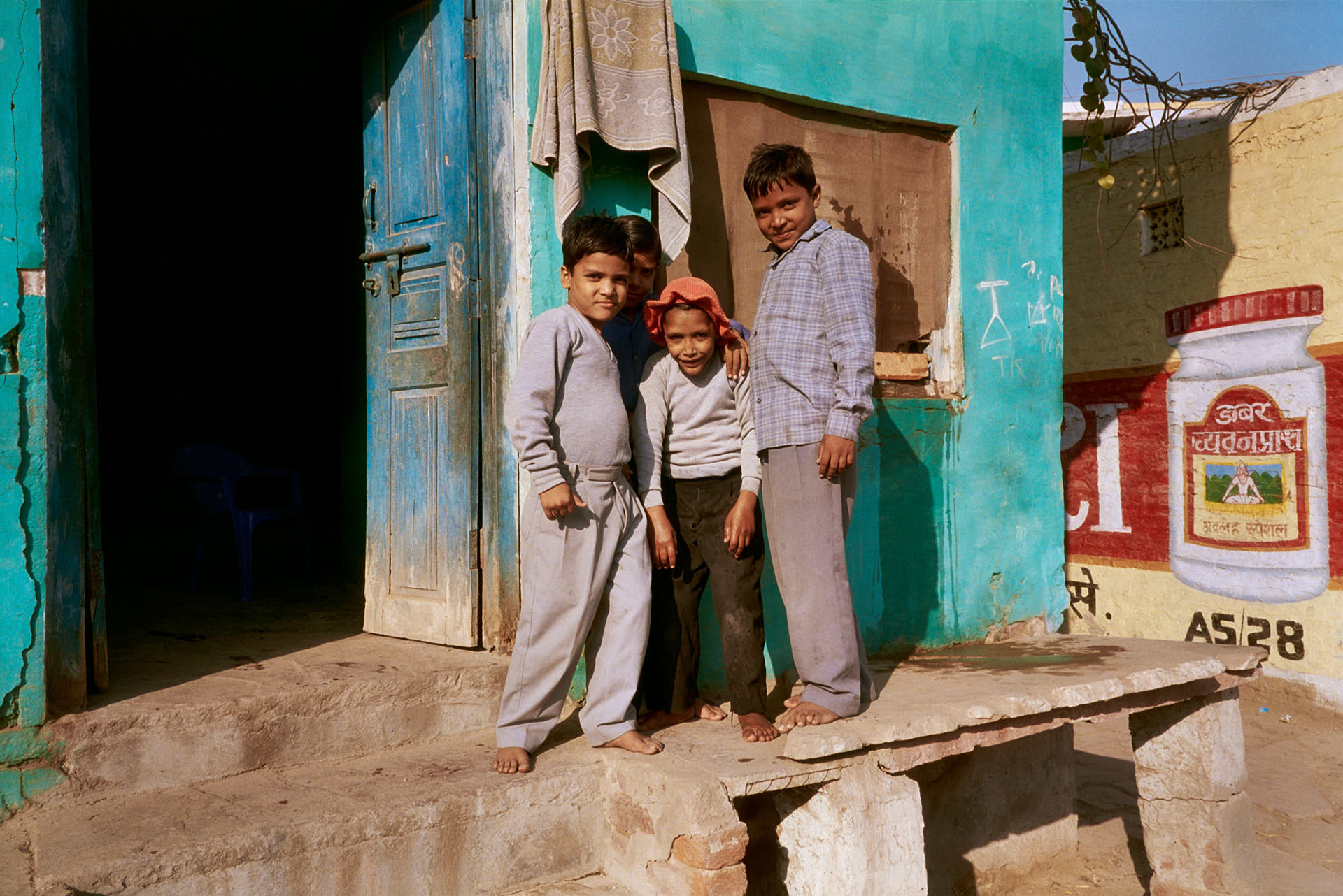 India Deeg - Our Deeg Palace guide invited us for tea at his house, where his children playfully posed for us.