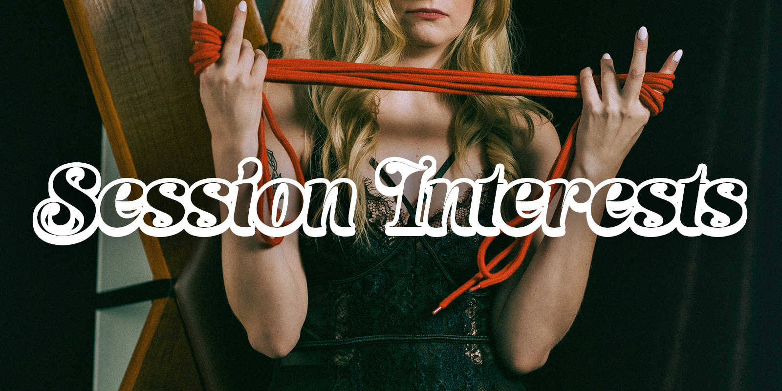 Lady Meredith holds shibari rope in front of a St. Andrews cross, preparing for bondage and BDSM services in Dayton, Ohio.