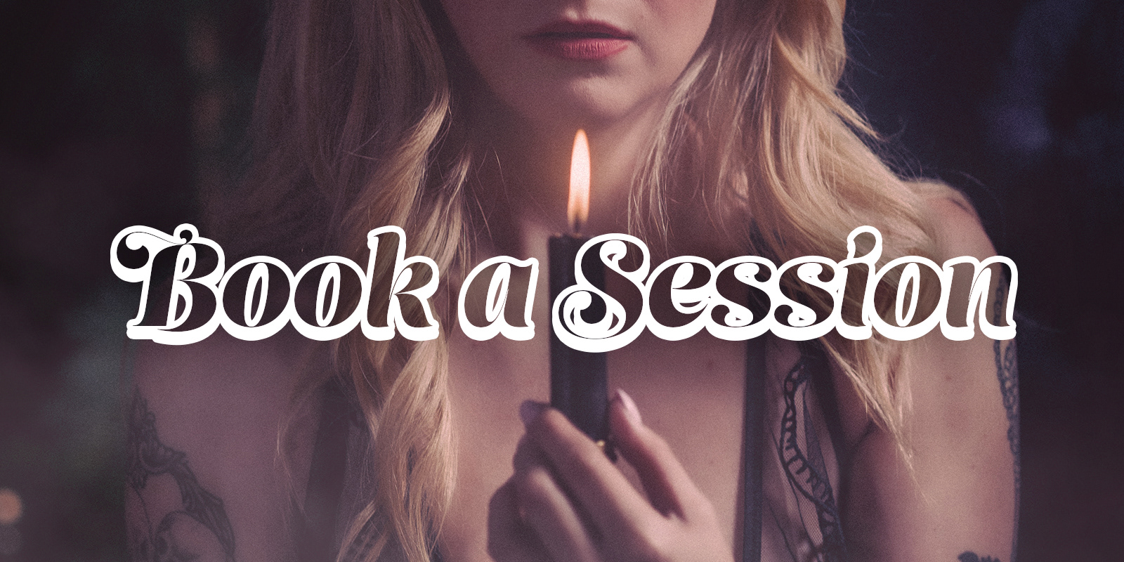 Lady Meredith holds a candle preparing for wax play in her Dayton, Ohio dungeon where she offers BDSM and dominatrix services.