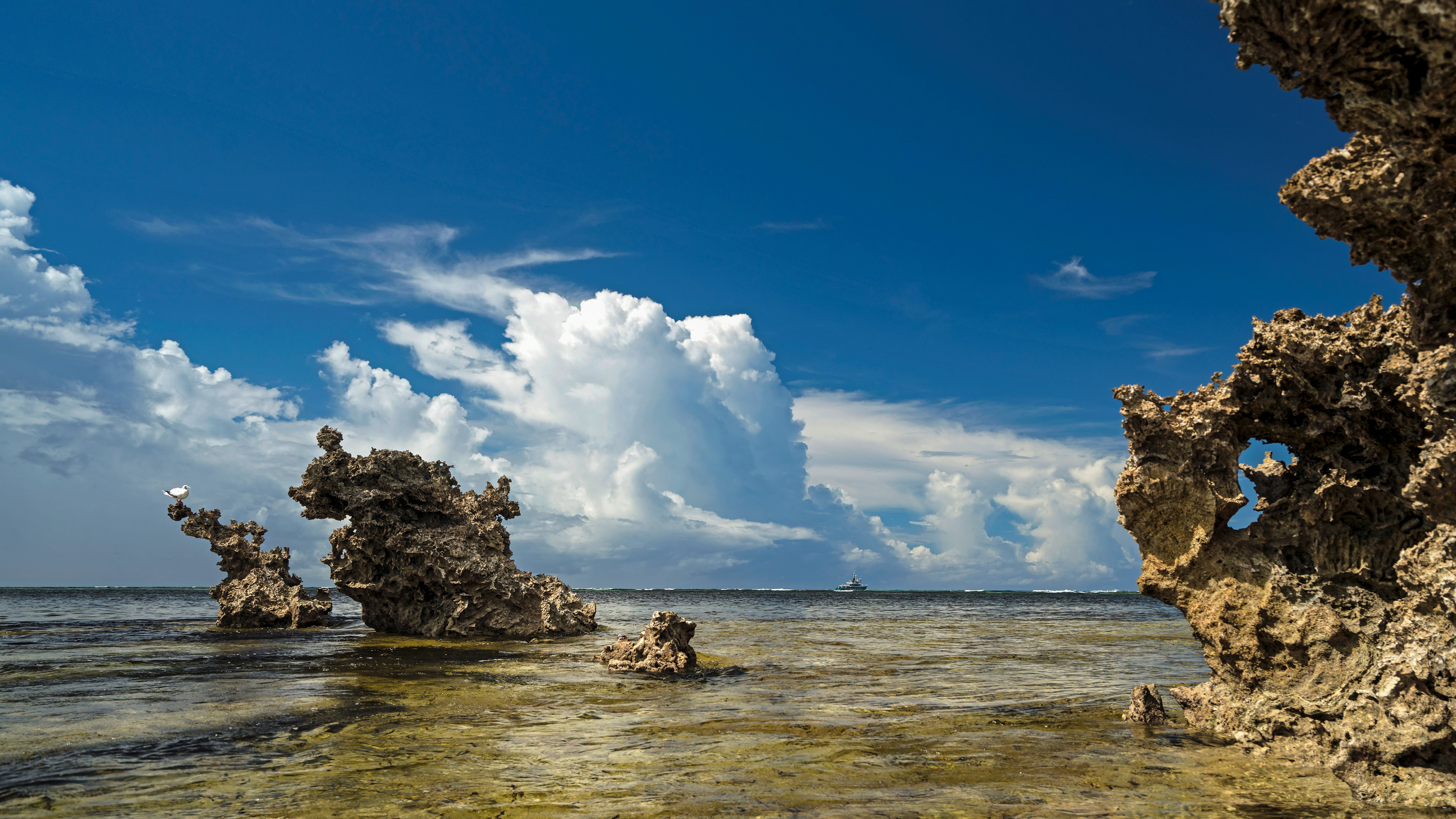 Cosmoledo, Aldabra Group, Seychelles Outer Islands, clouds taking lead from coral outcrops