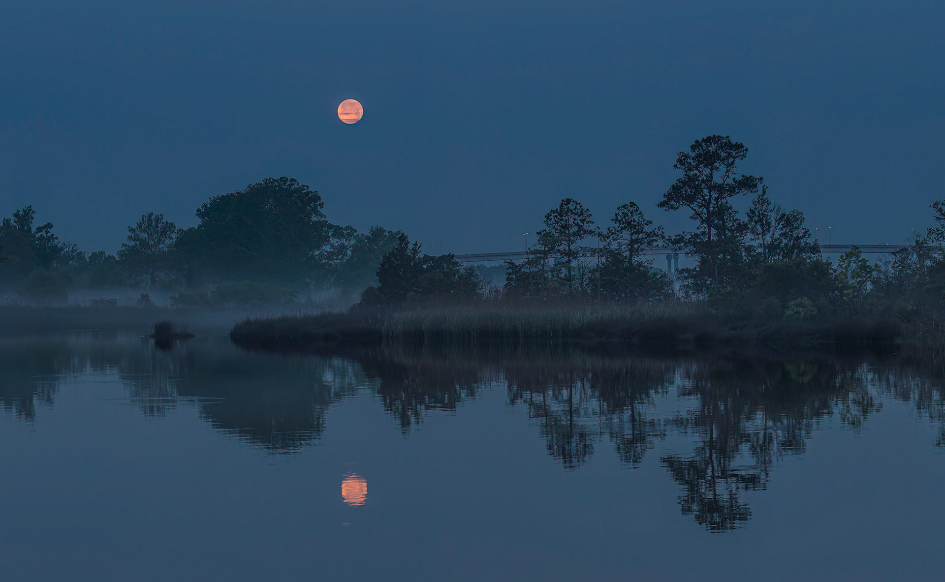 Moon setting over the Sampit River