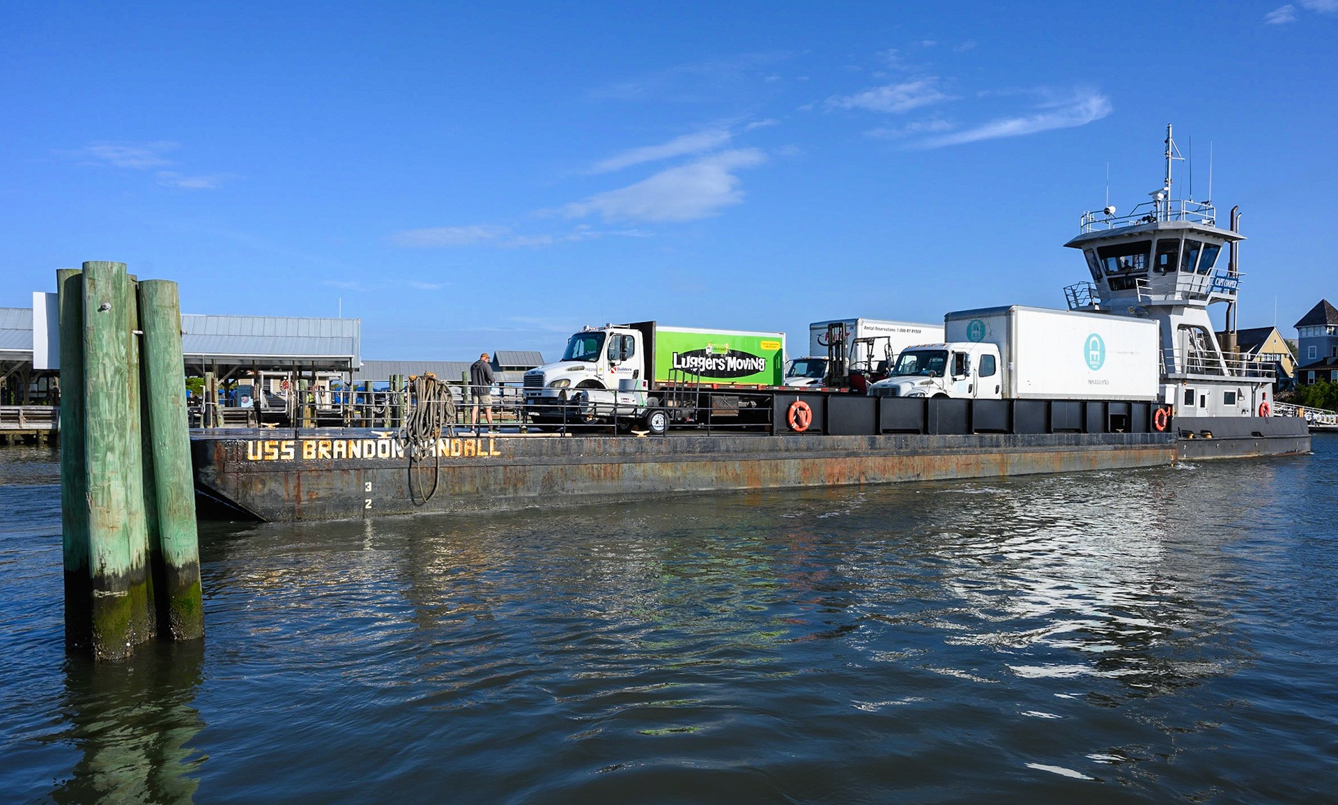Barge transporting service vehicles back and forth to Southport