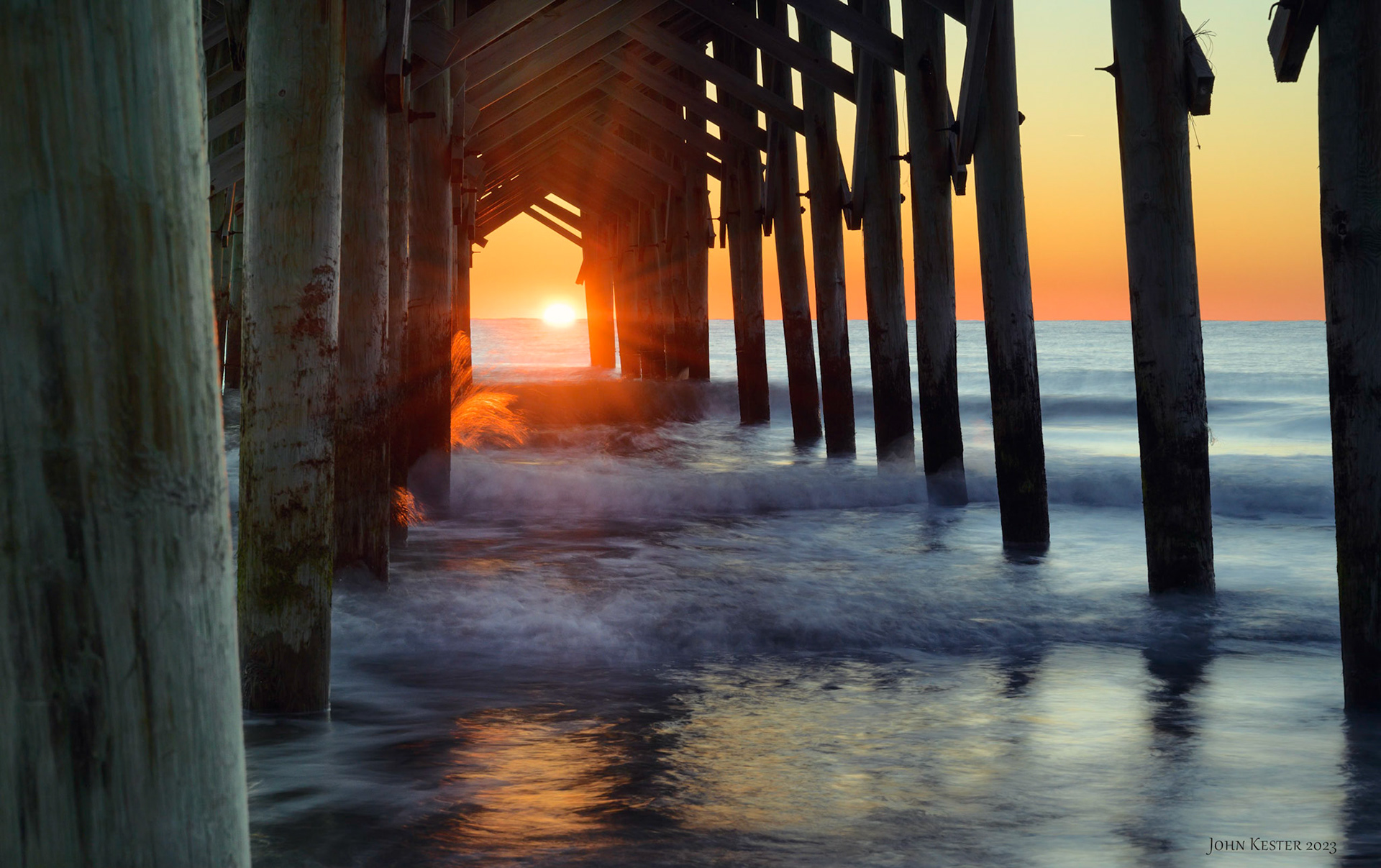 Pawleys Island sunrise through the pier