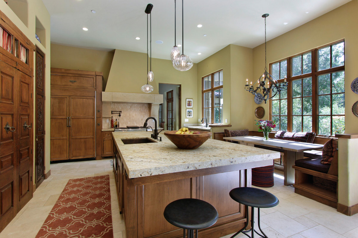 muted-green-and-natural-cherry-kitchen-with-large-stone-island